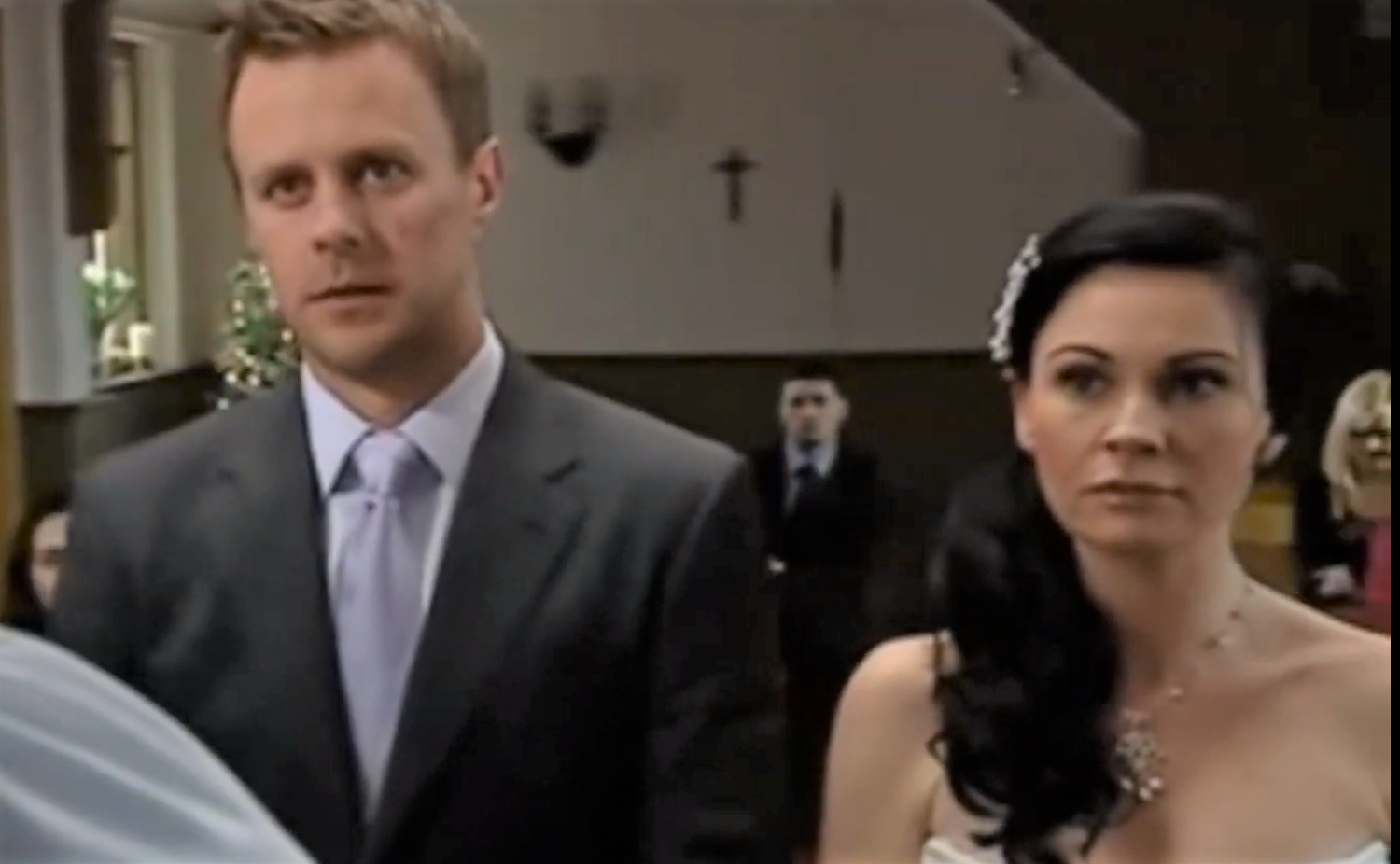Carl King and Chas Dingle look seriously unhappy at their church wedding