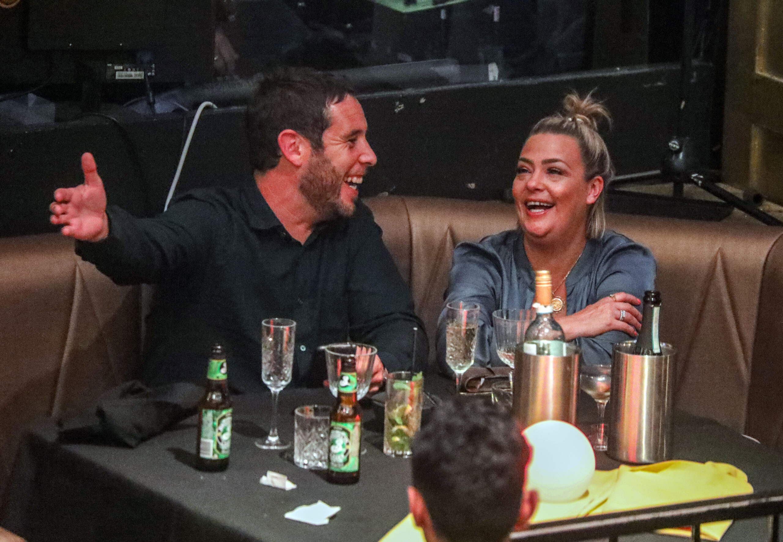 Lisa Armstrong and James green laugh during date night at Proud Cabaret