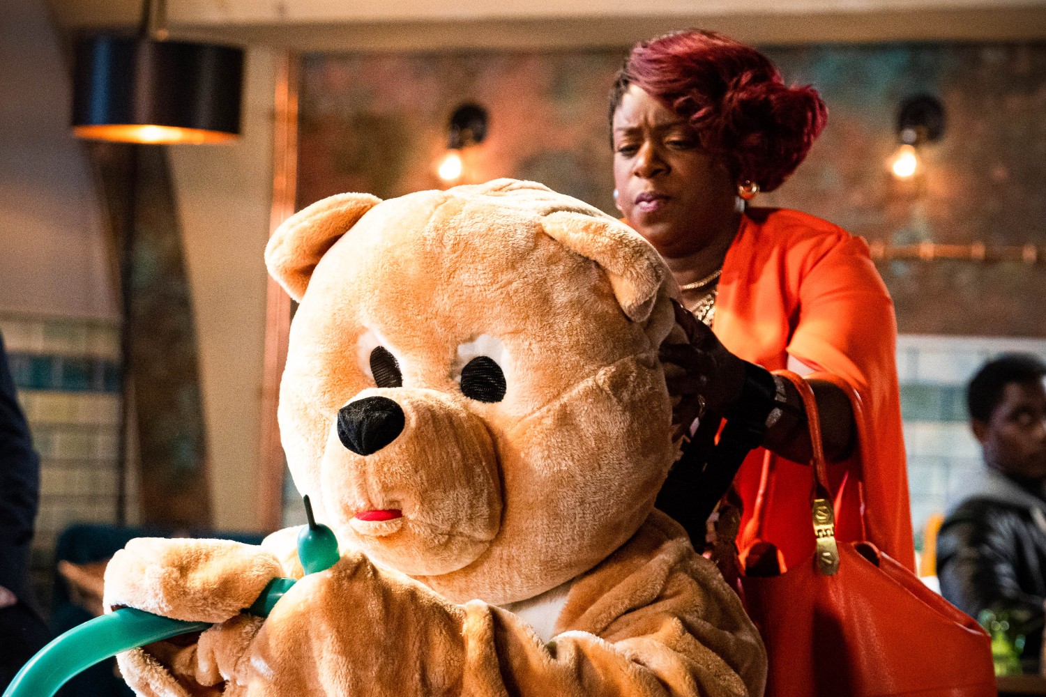 EastEnders Kim looks confused as she removes the entertainers costume