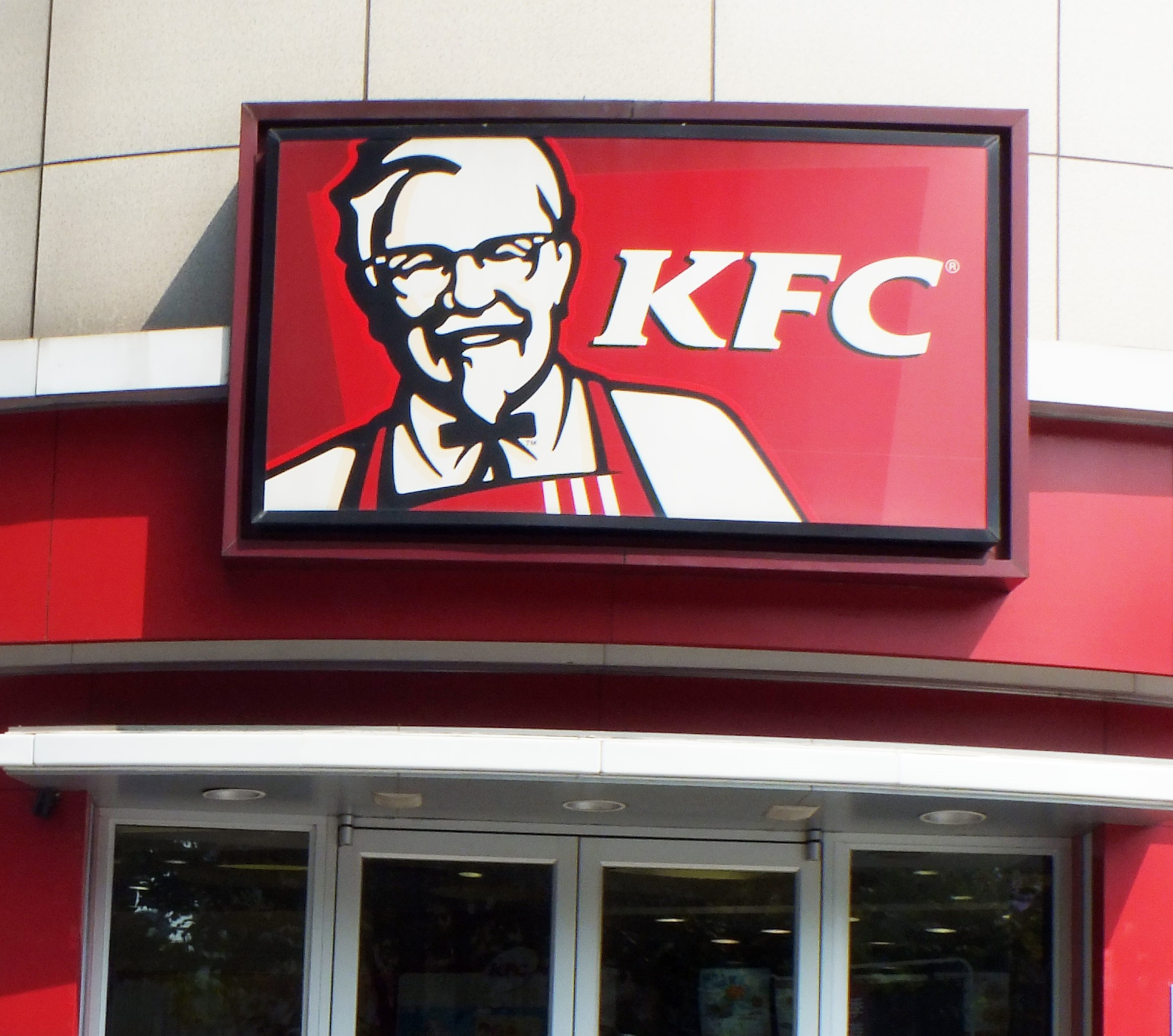 Holly Willoughby blouse compared to Colonel Sanders from the iconic KFC logo today