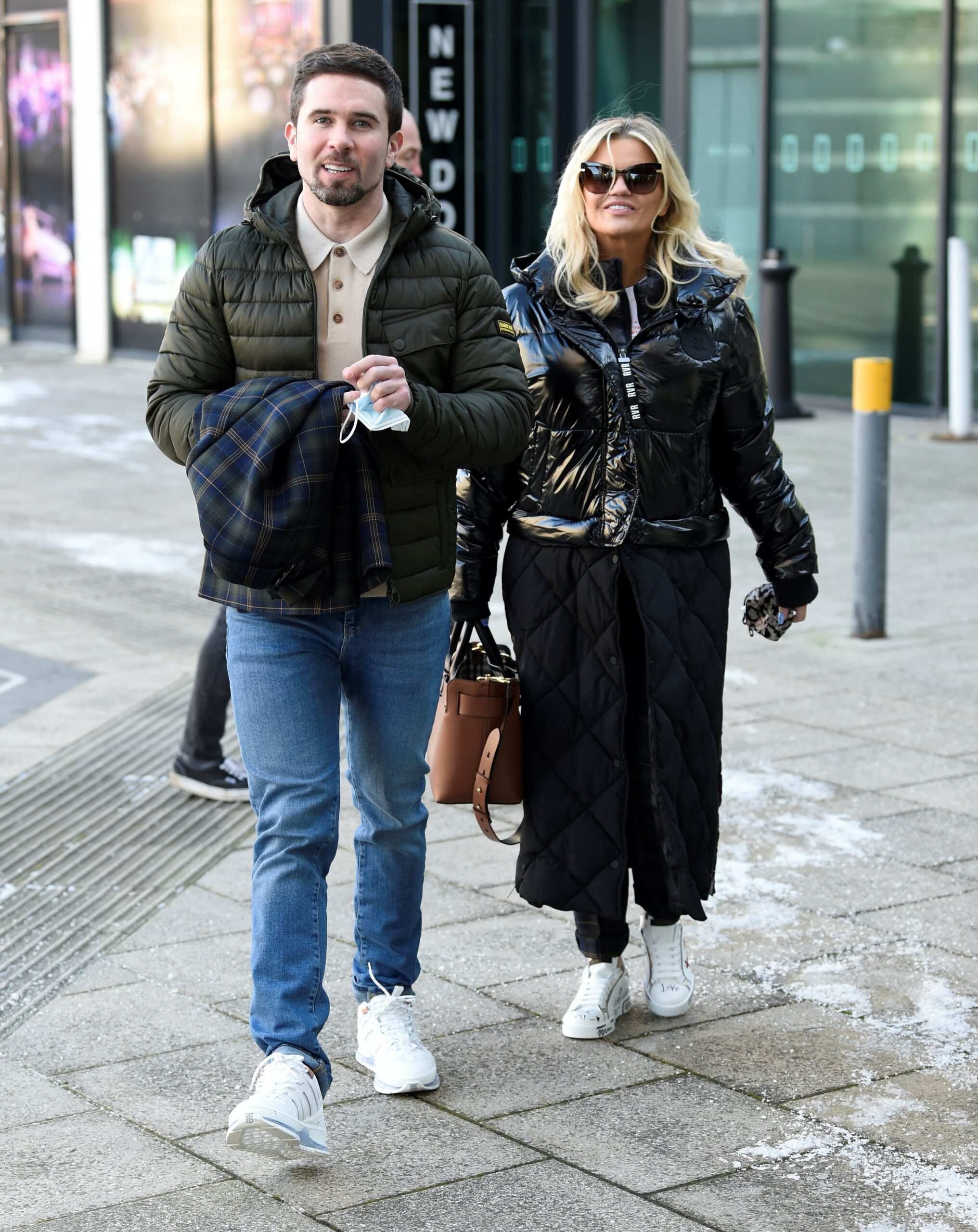 Kerry Katona walks with her fiance Ryan Mahoney