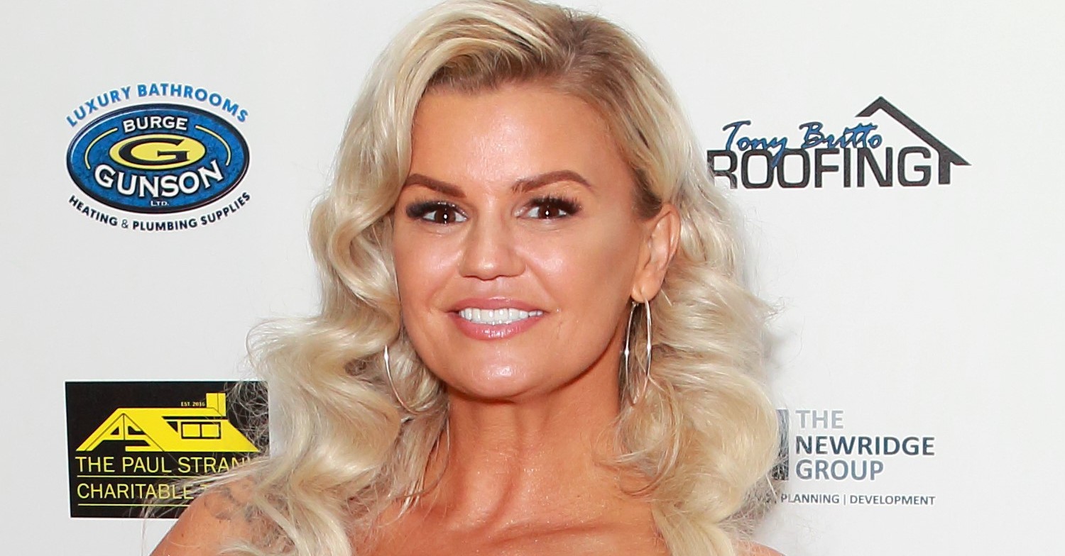 Kerry Katona smiles on red carpet