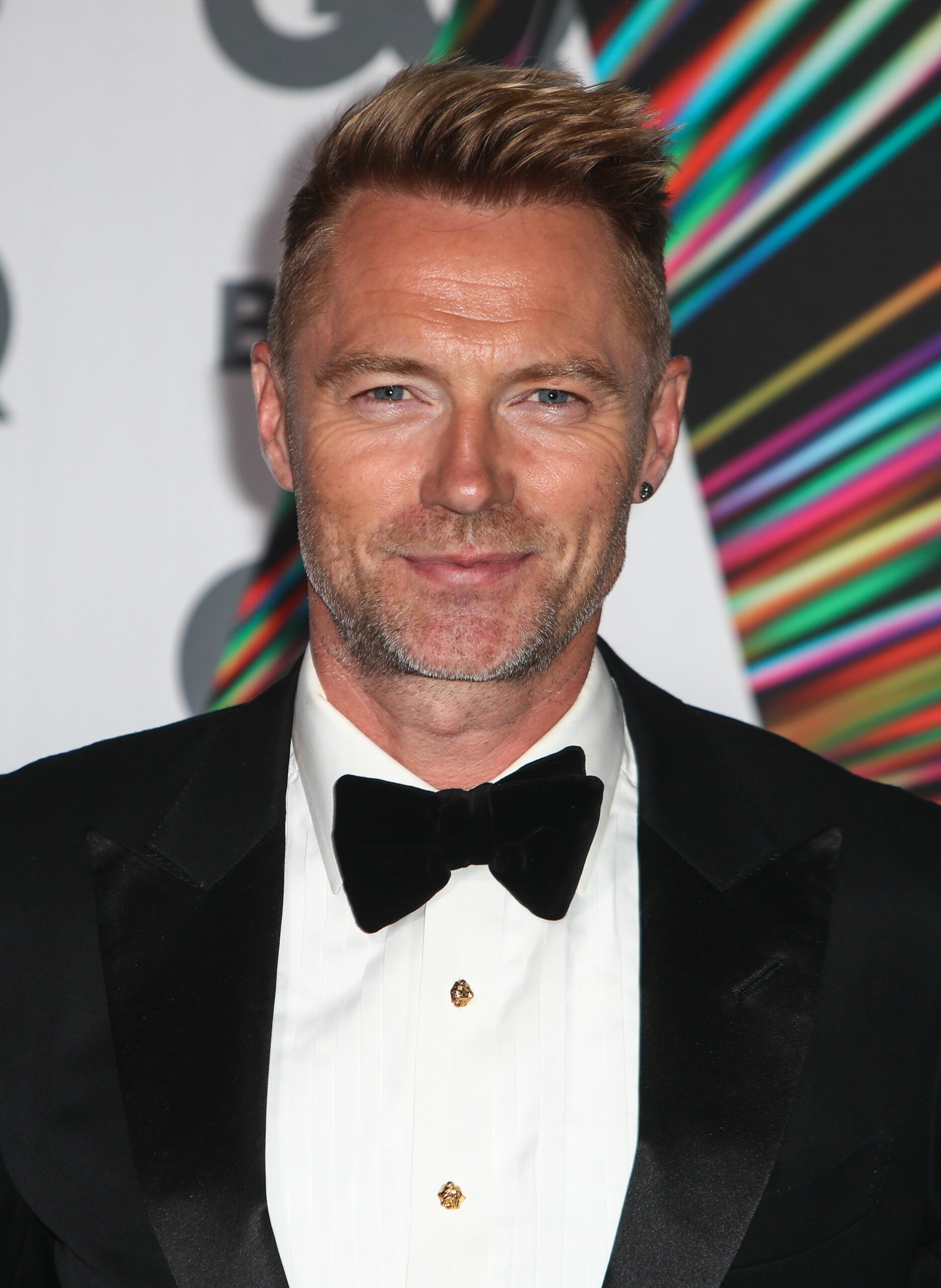 Ronan Keating smiles at red carpet event