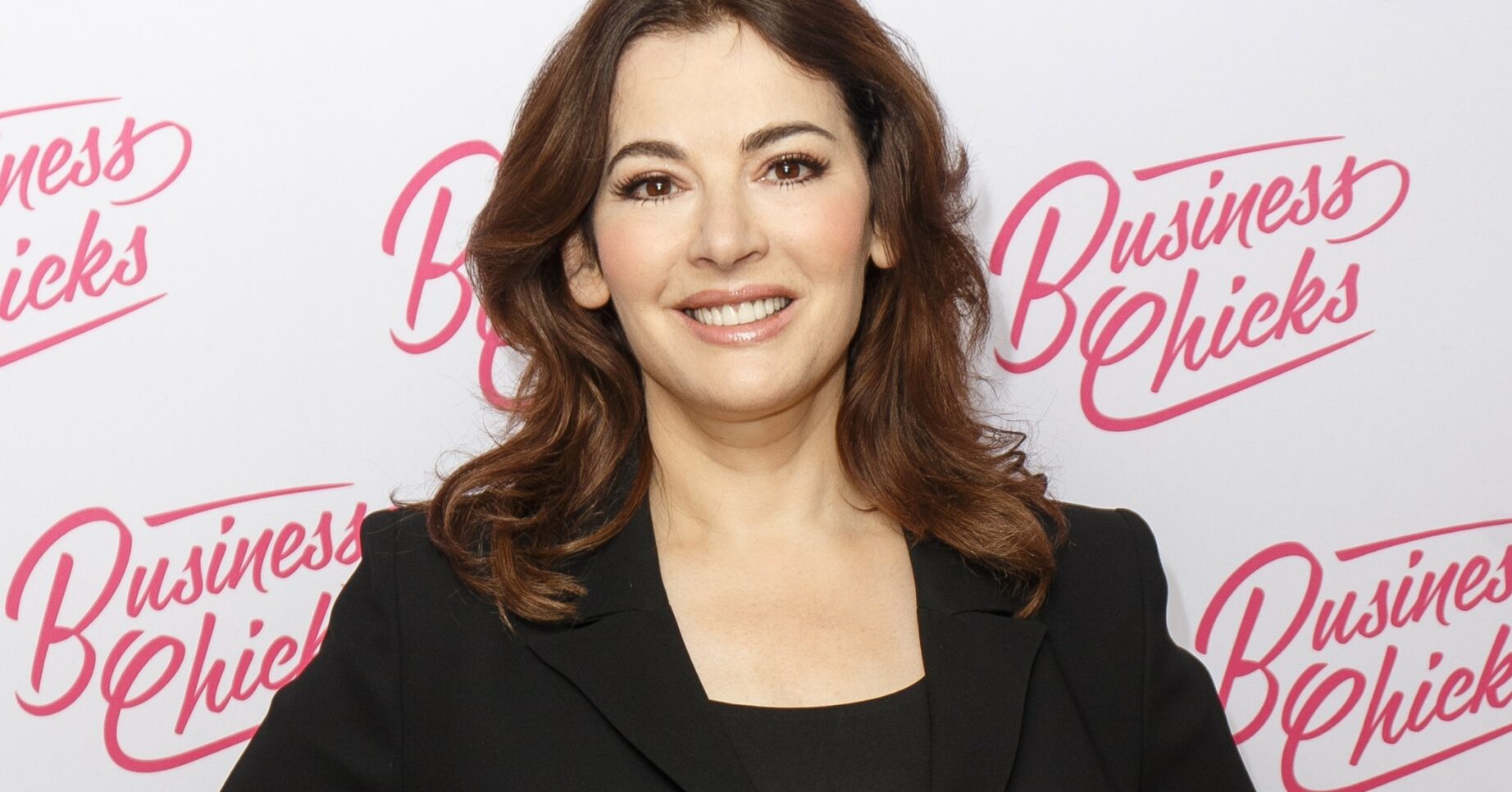 Nigella Lawson smiles on red carpet