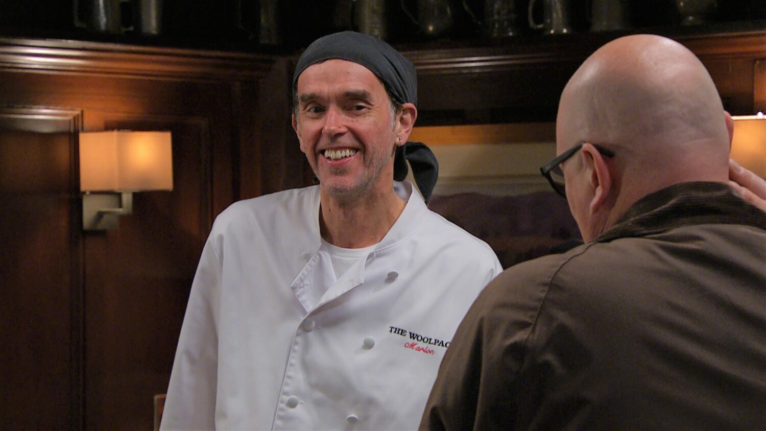 Marlon is smug as he talks to Paddy in the Woolpack in Emmerdale