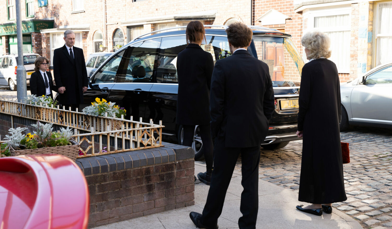 Sam held Nick's hand as they made their way to Natasha's funeral