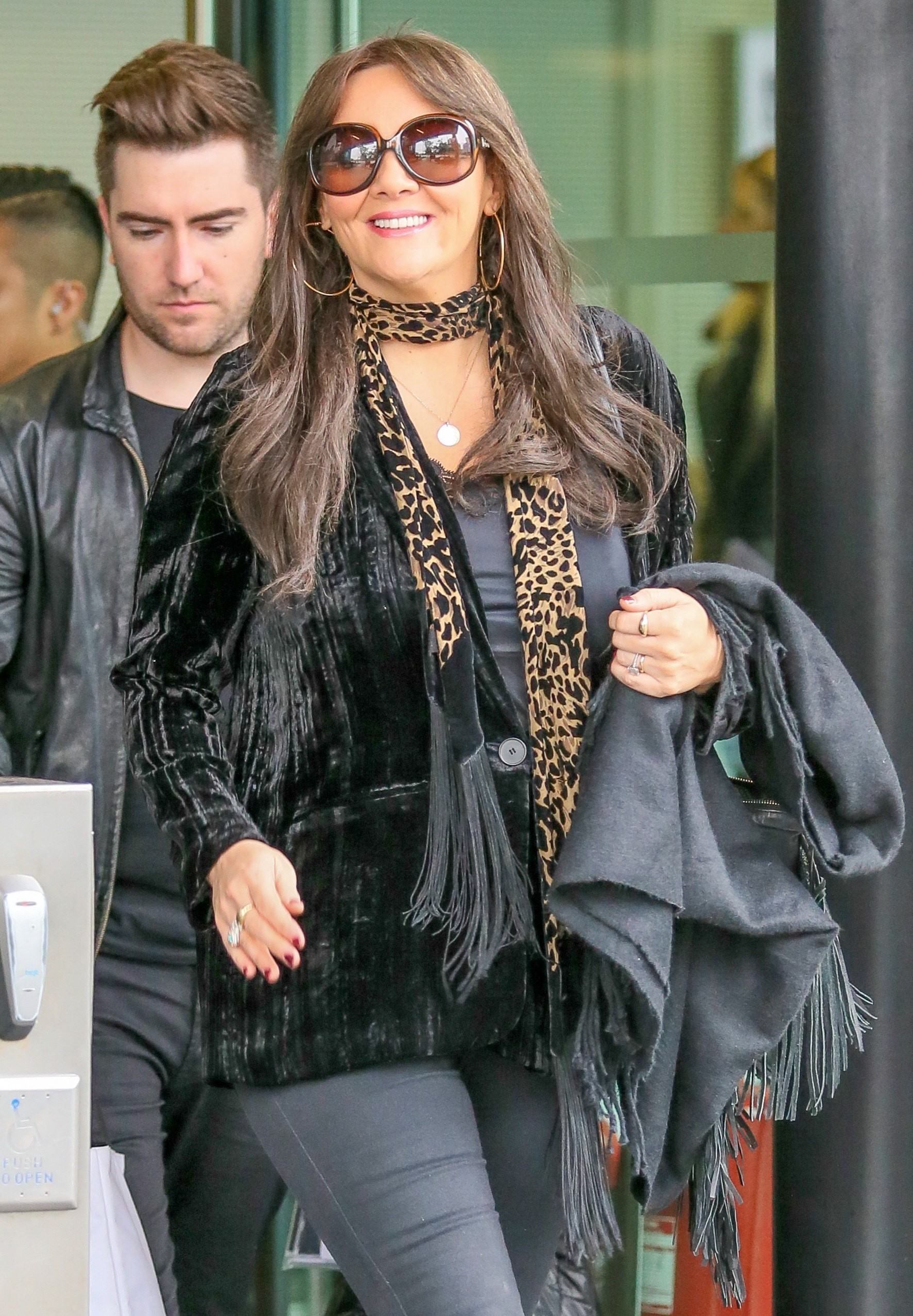 Martine McCutcheon smiles to cameras