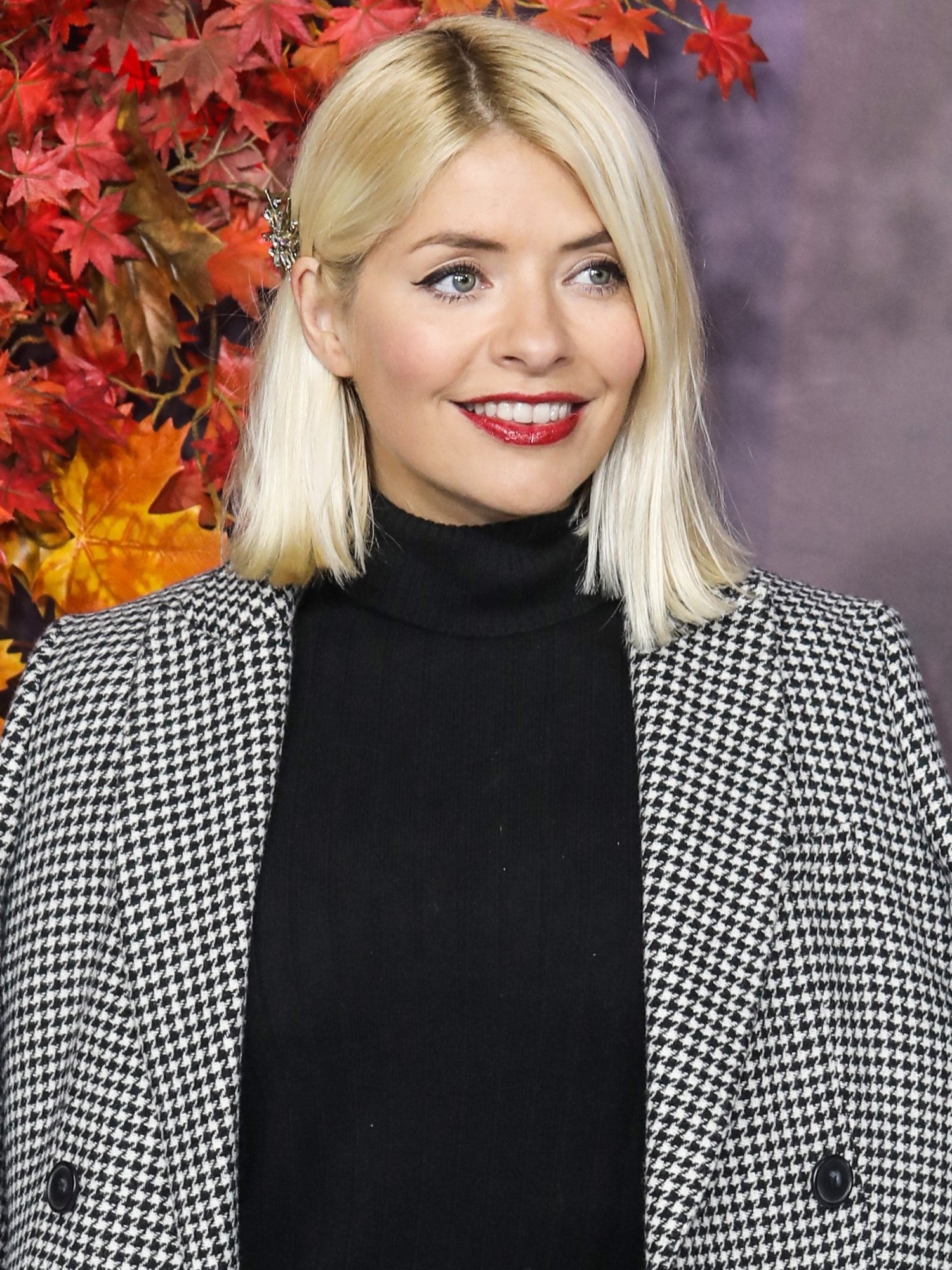 Holly Willoughby smiles on red carpet