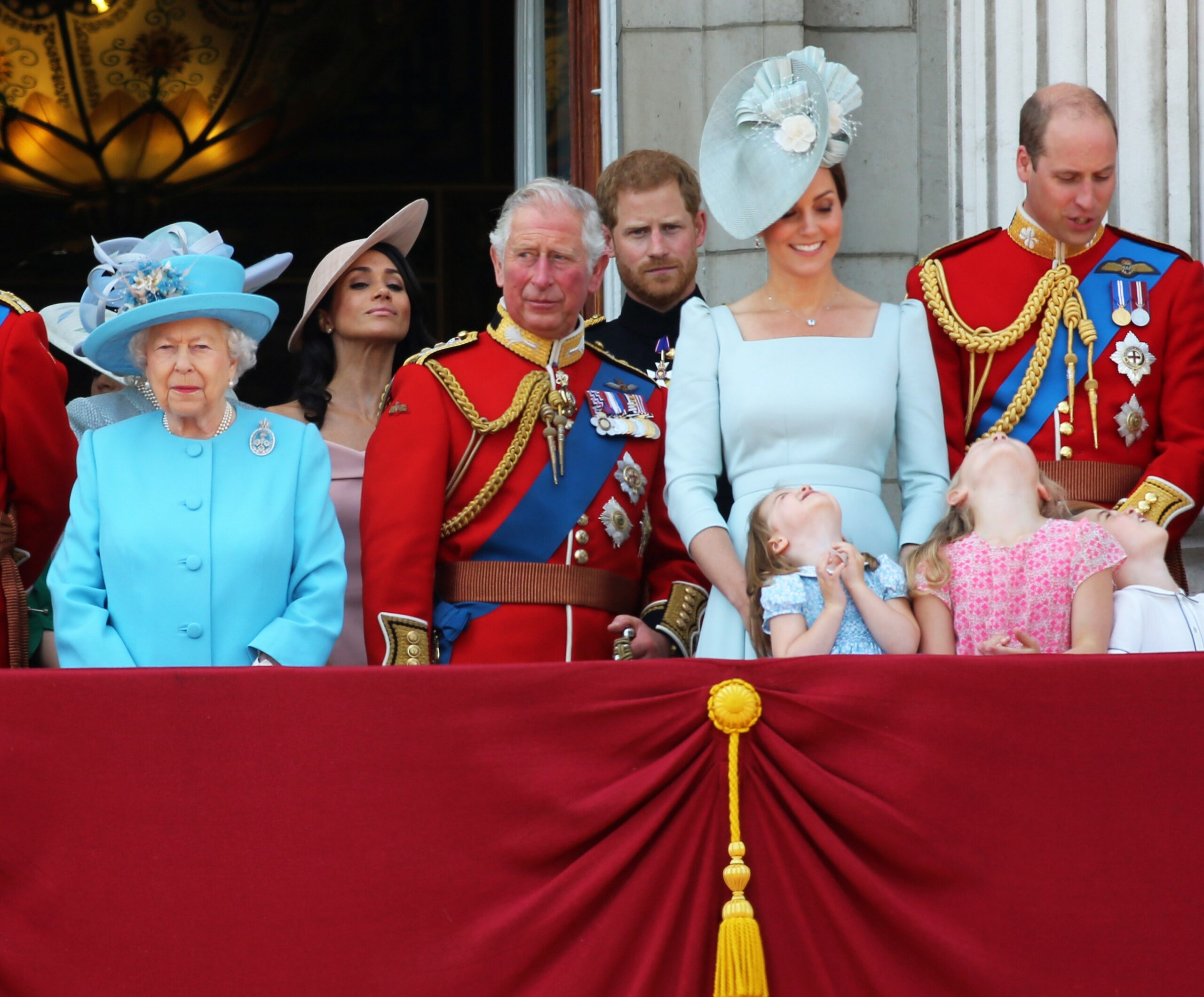 The Queen stands on the balcony with members of the royal family