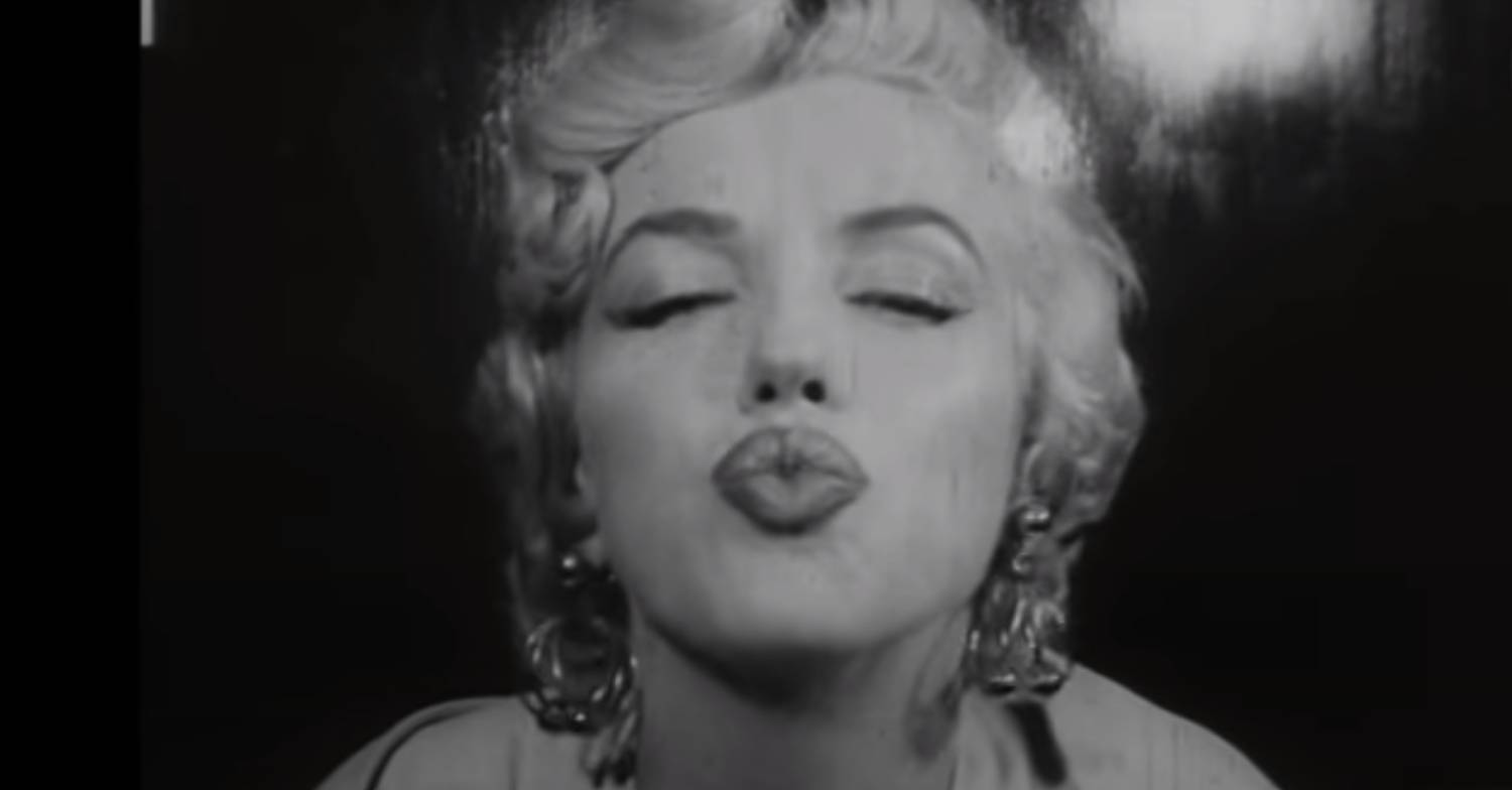 Marilyn Monroe blows a kiss to the camera