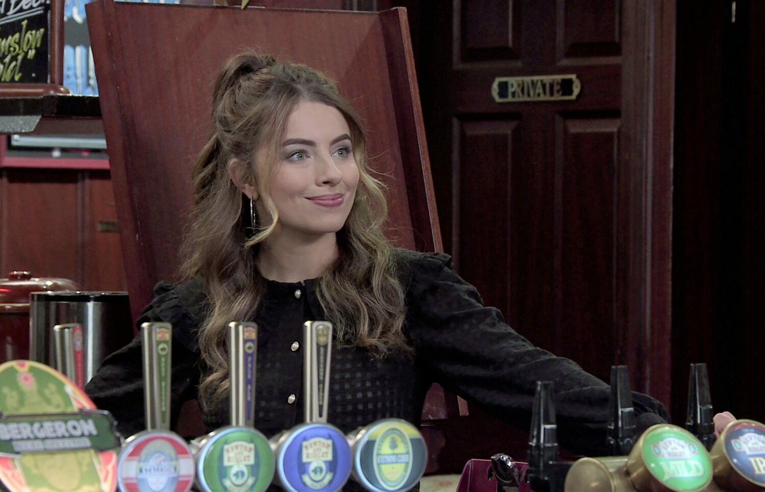 Coronation Street Daisy in the Rovers looking happy