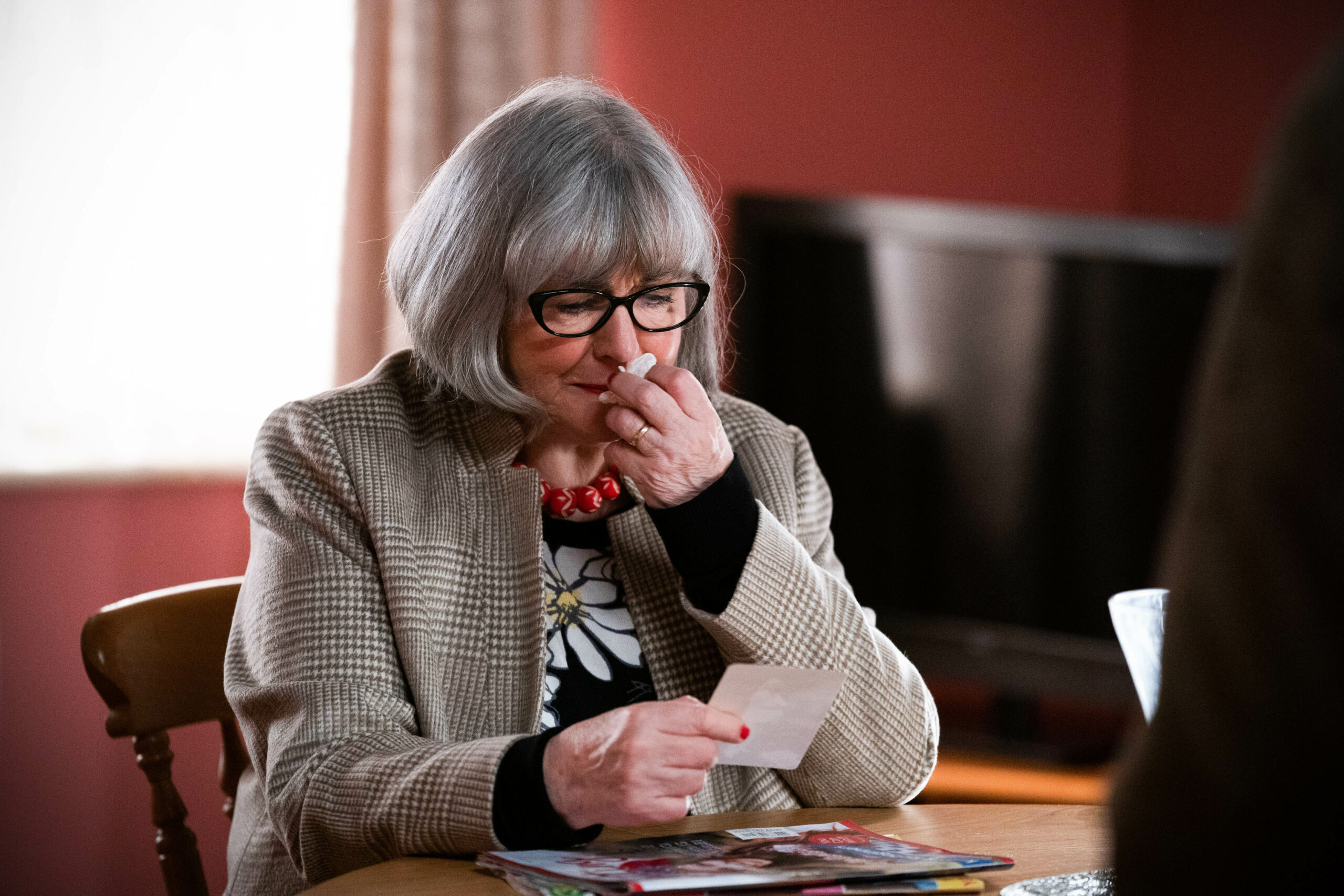 EastEnders Vi cries with emotion as she looks at an old photograph