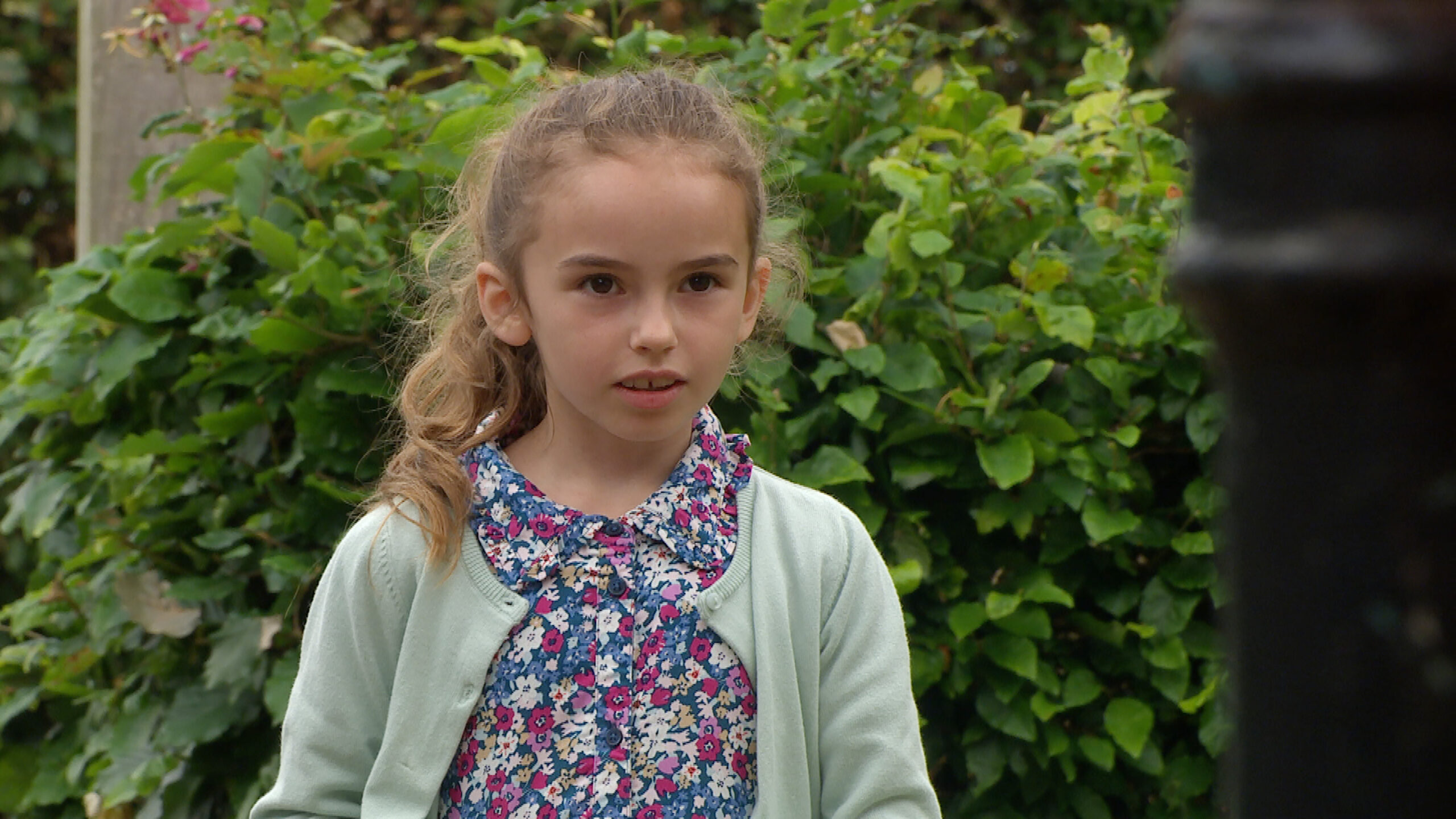 Millie Tate in Emmerdale looking shocked 