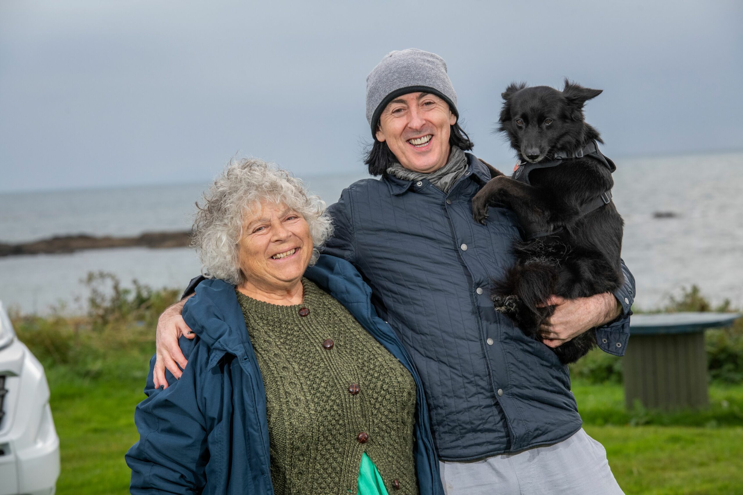 Miriam Margolyes and Alan Cummings pose with his dog
