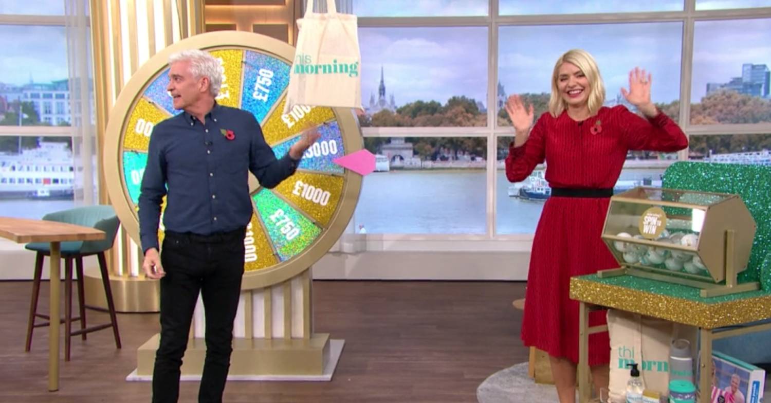 Phil speaks away from the camera as if asking someone to winch the bag back up