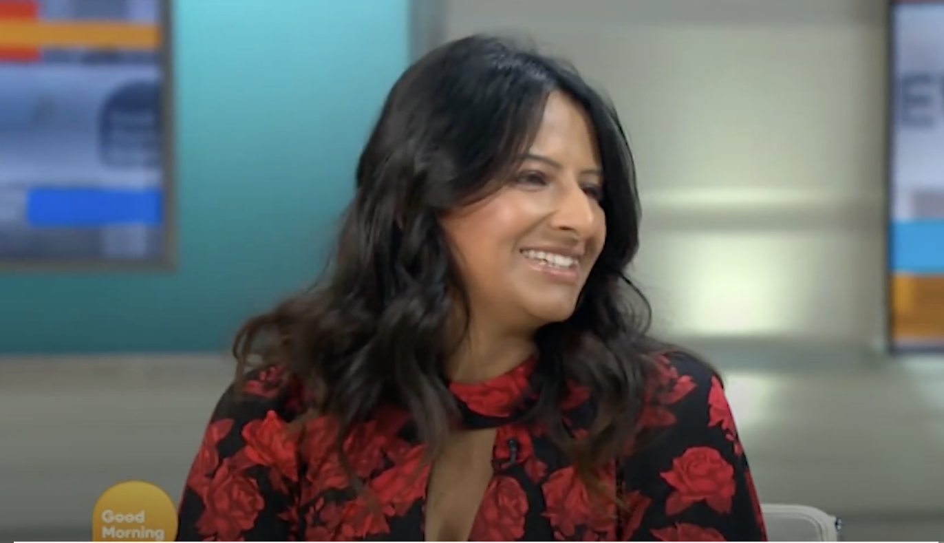 Ravina Singh smiling at Ed Balls 