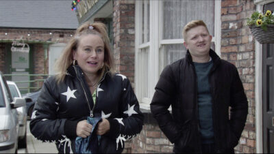 Gemma and Chesney looking happy in the street on Coronation Street