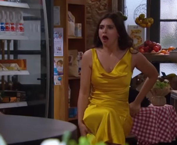 Emmerdale Meena looks shocked in her yellow dress at David's shop