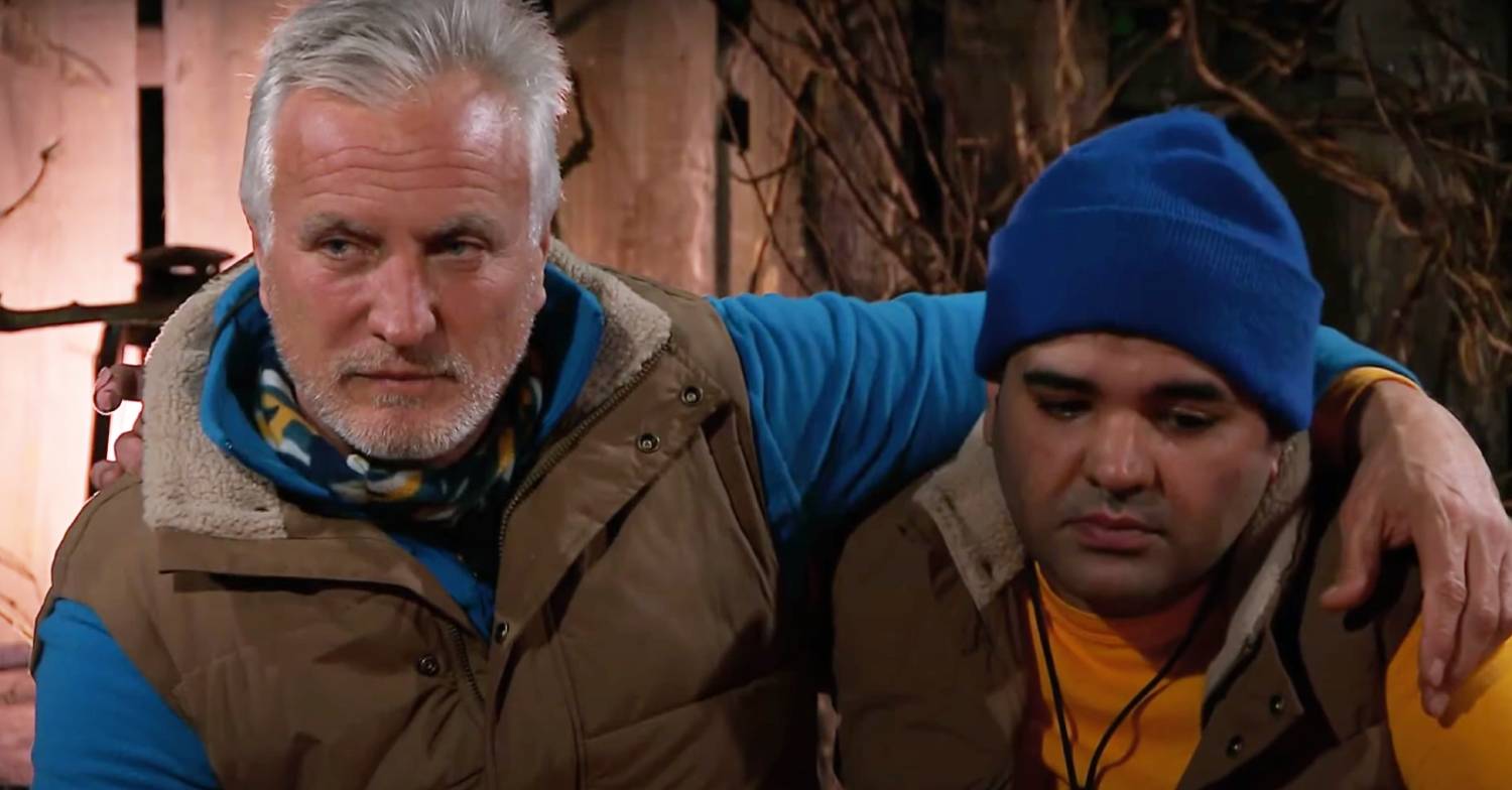 David Ginola puts a comforting arm around Naughty Boy on I'm A Celebrity