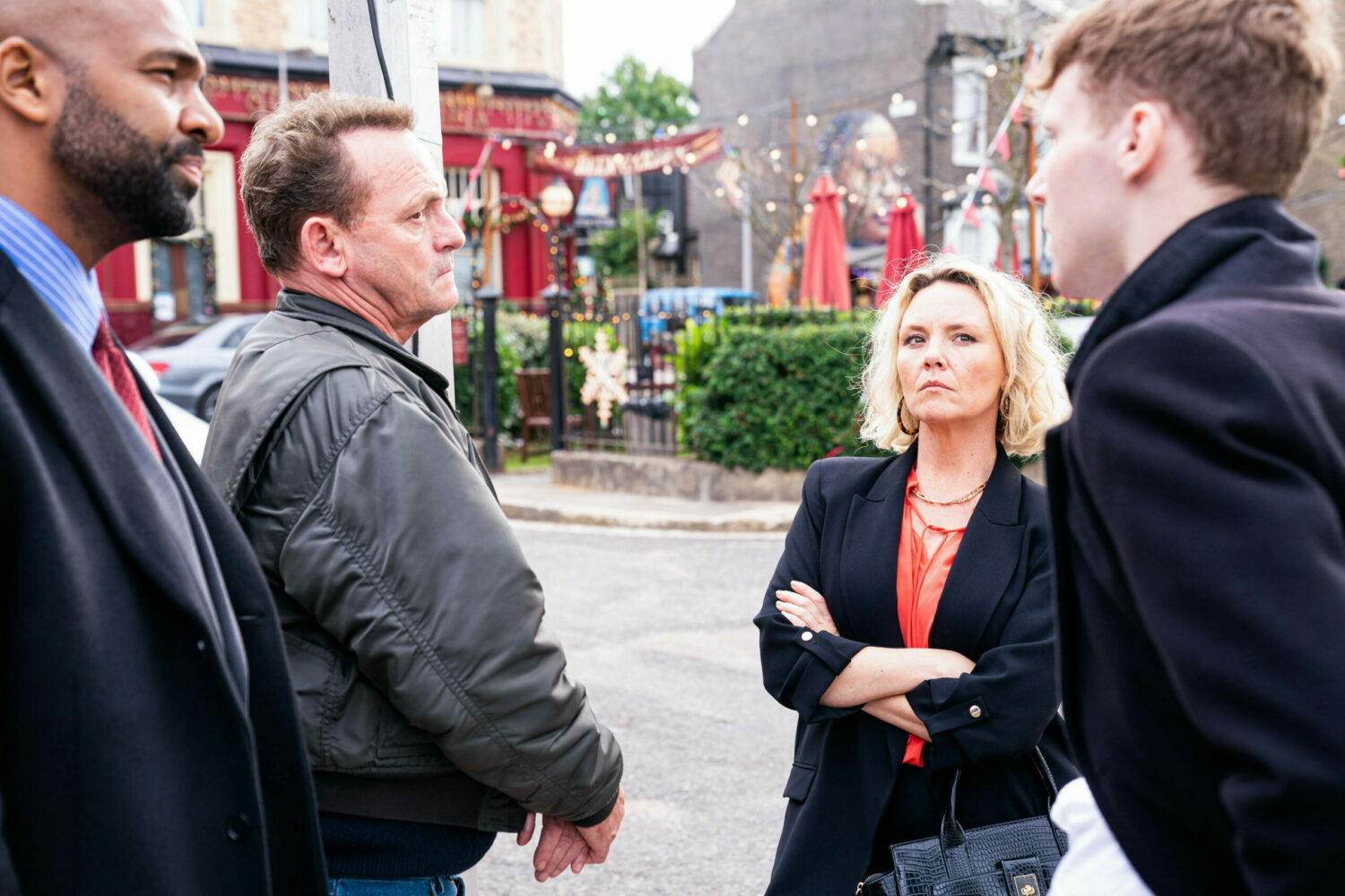 EastEnders Janine looks on as Billy argues with Jay