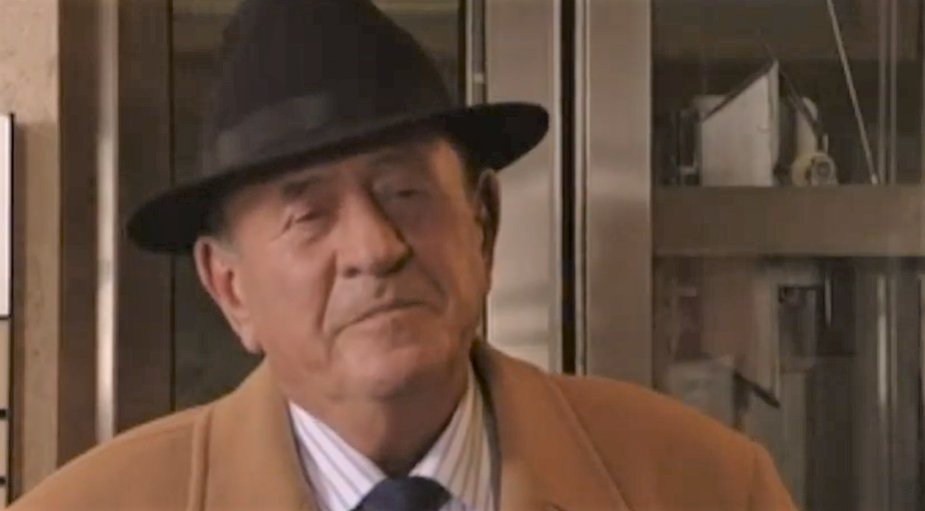 EastEnders Frank Butcher looks pleased as he talks to Pat at court
