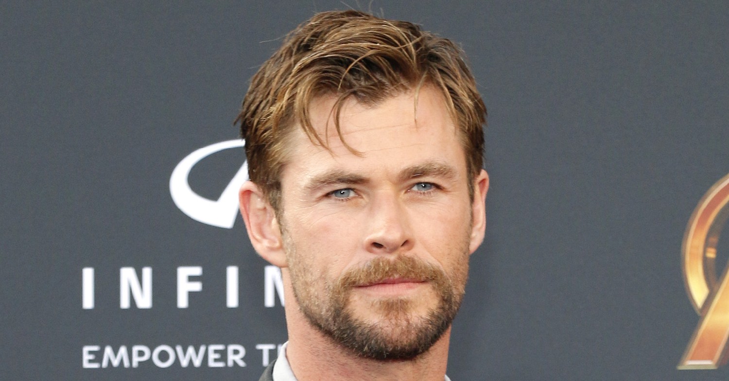 chris hemsworth looks broody on the red carpet (SplashNews)