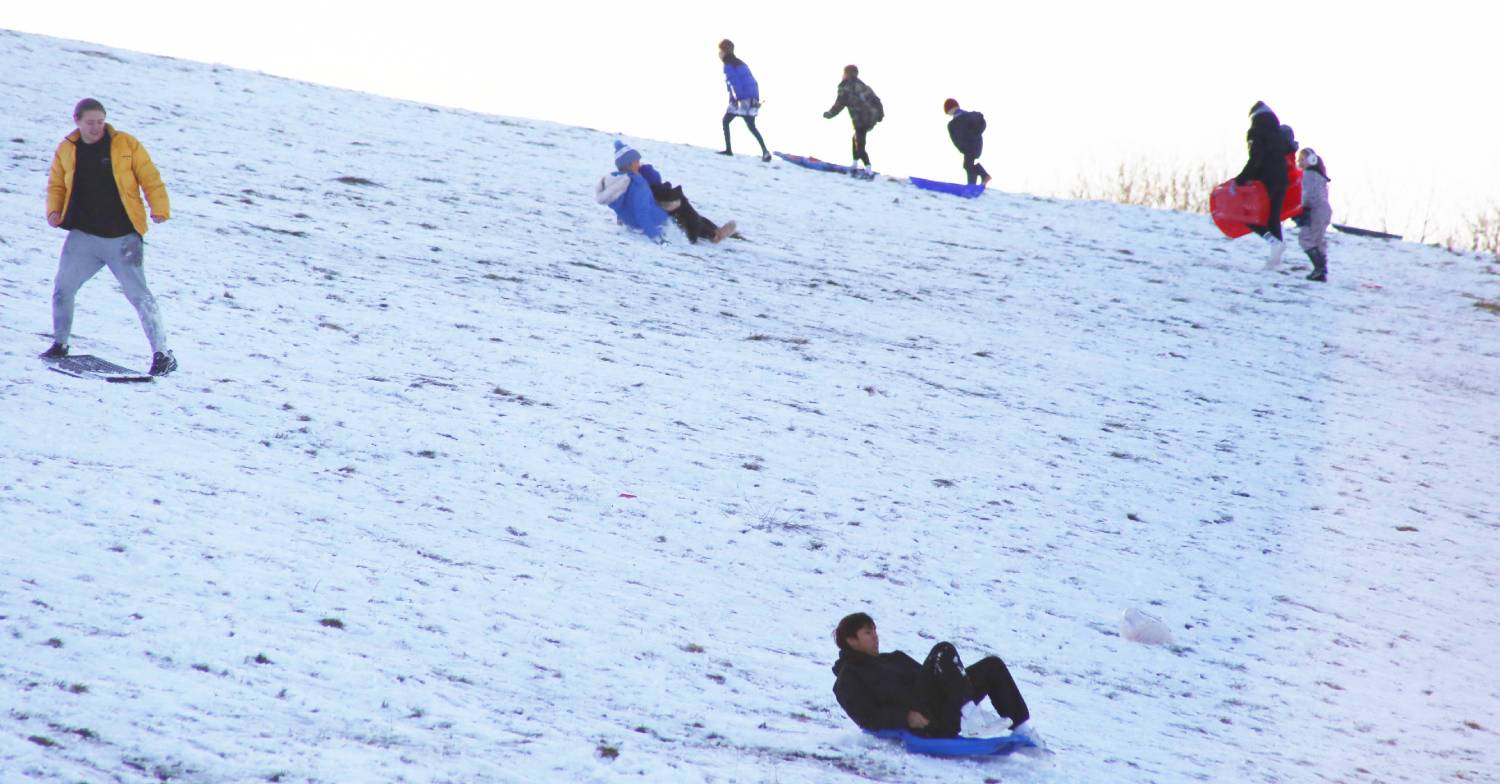 Snow forecast as people enjoy sledging 