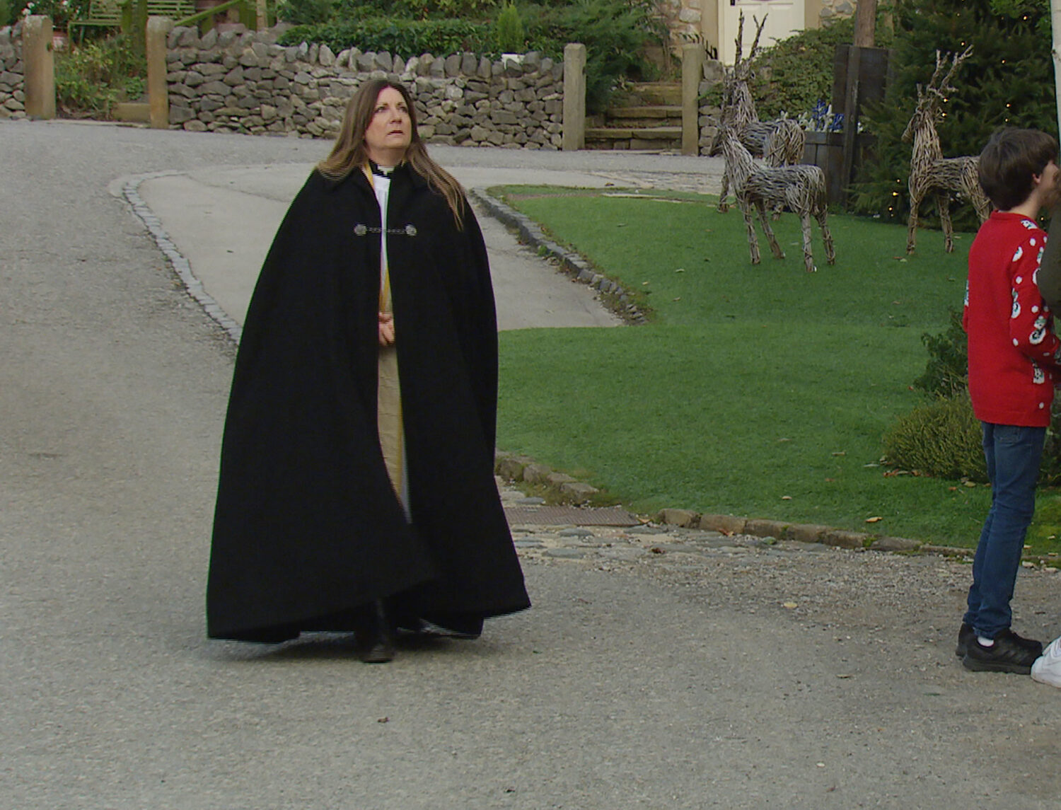 Emmerdale Dec 25 Harriet takes one last look at the church and removes her dog collar as she leaves the church
