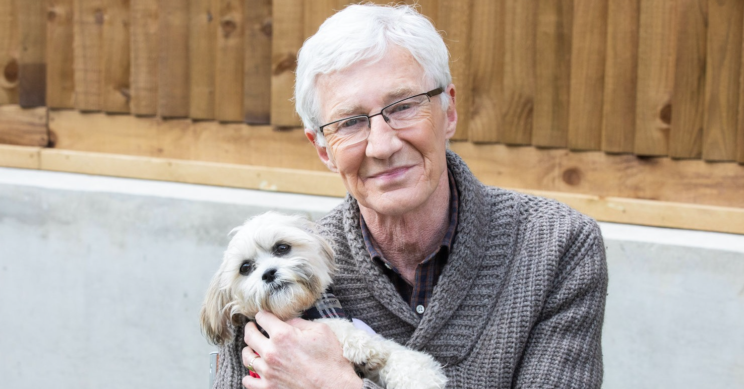 Paul O'Grady cuddles up with a little furry pal on For the Love of Dogs 