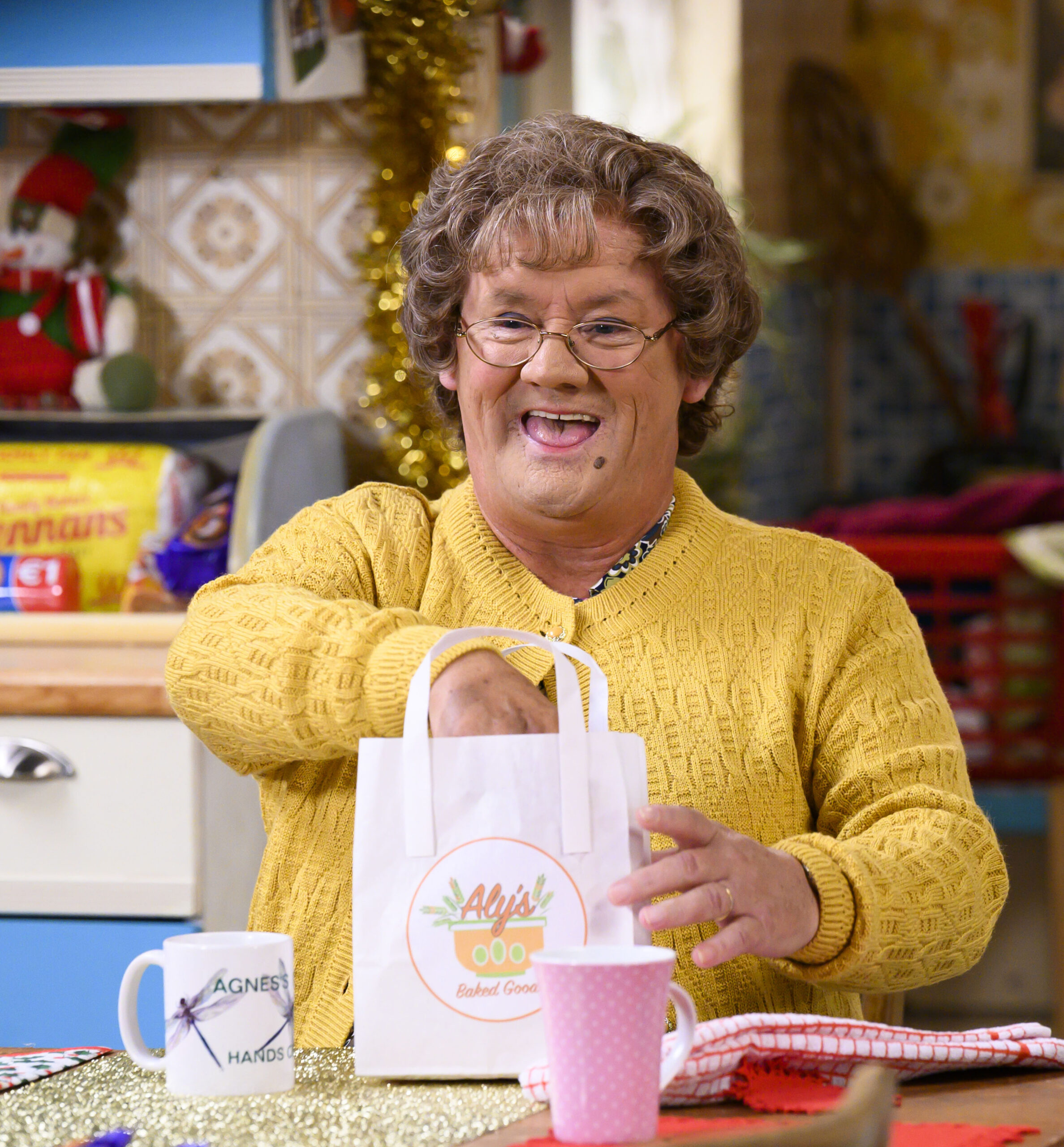 Mrs Brown in Mrs Brown's Boys with a bag of cakes
