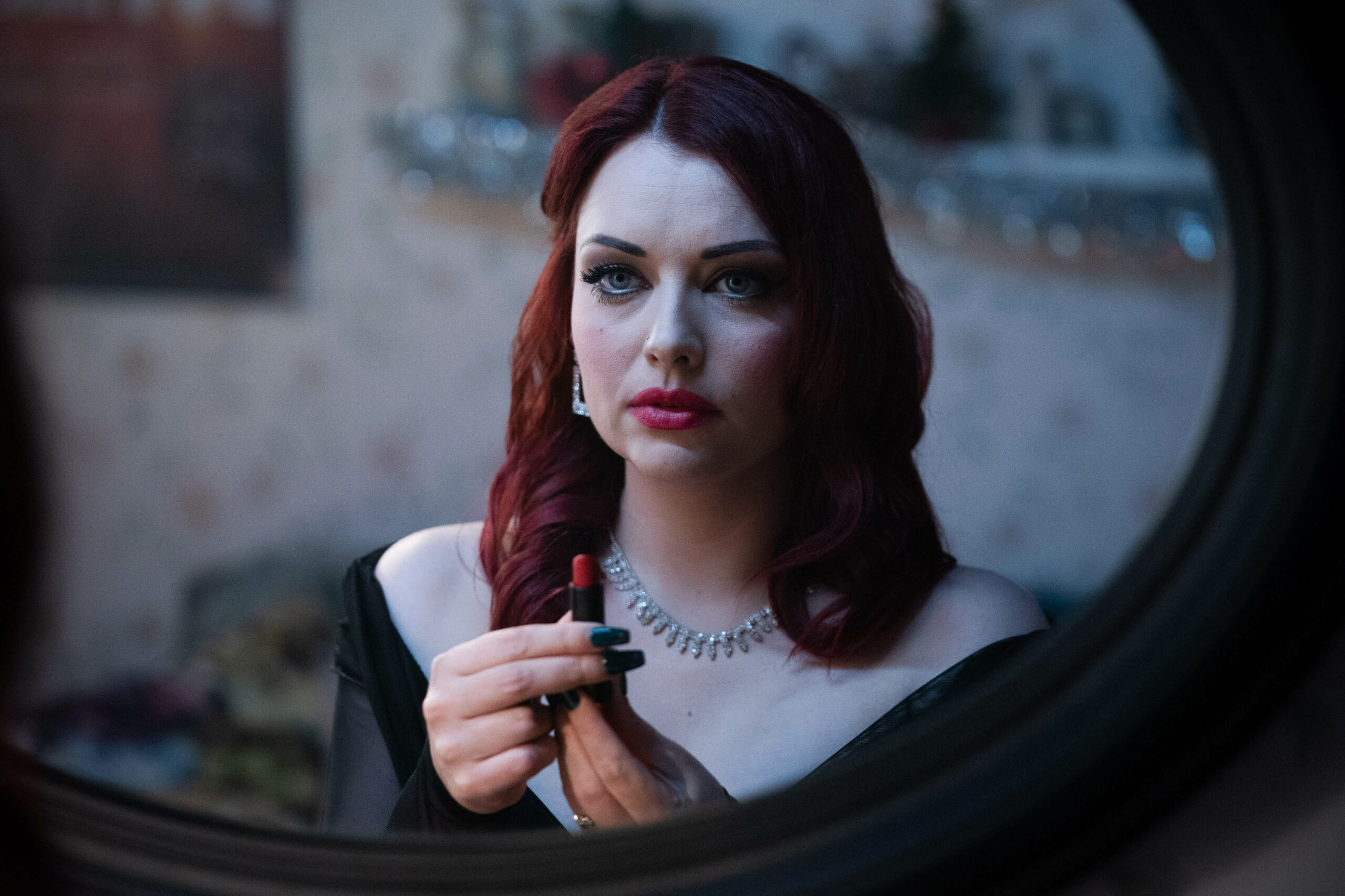 EastEnders Whitney has a plan and she knows what she must do as she puts lipstick on in the mirror