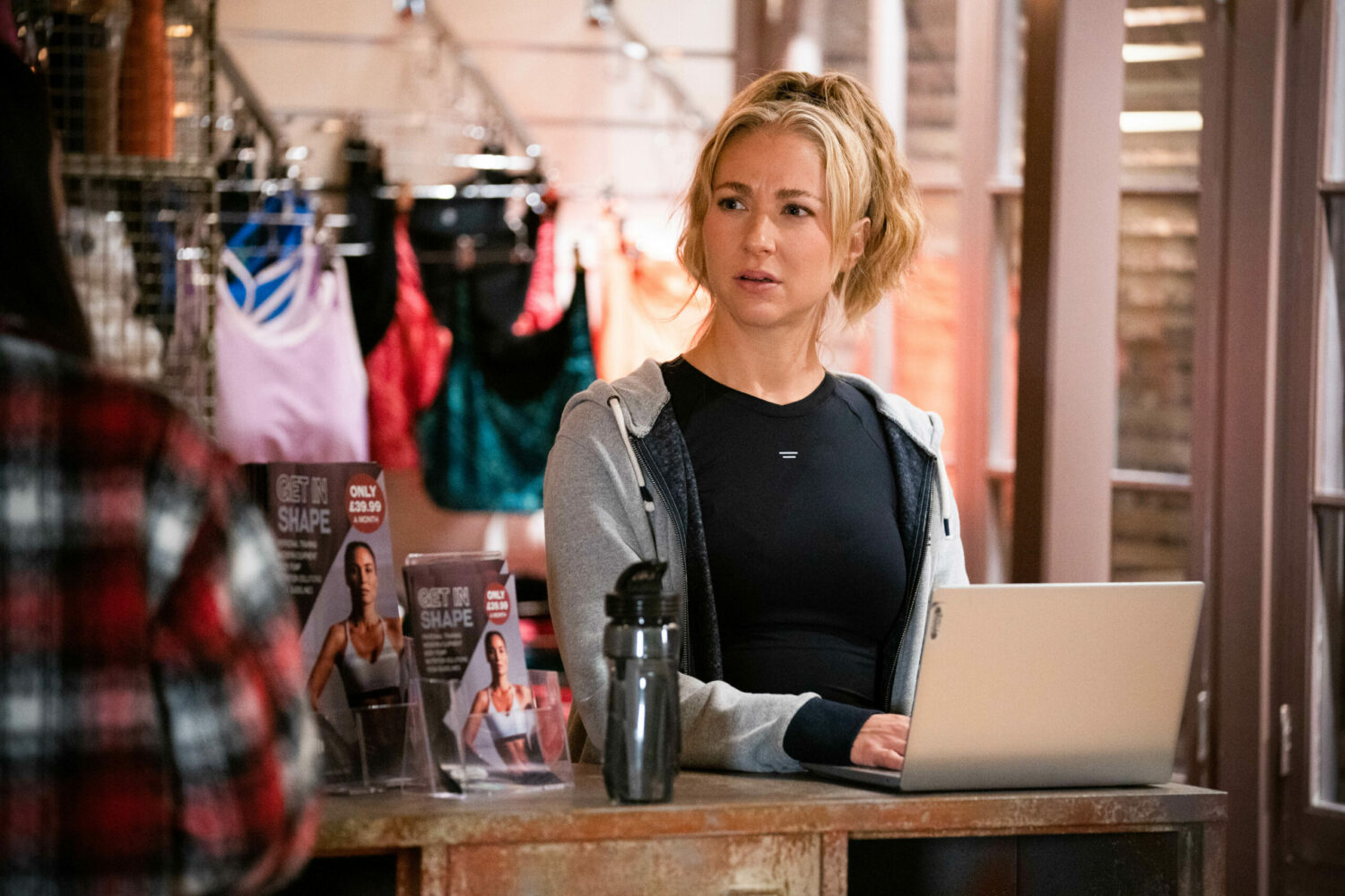Nancy Carter looking annoyed as she works on her laptop 