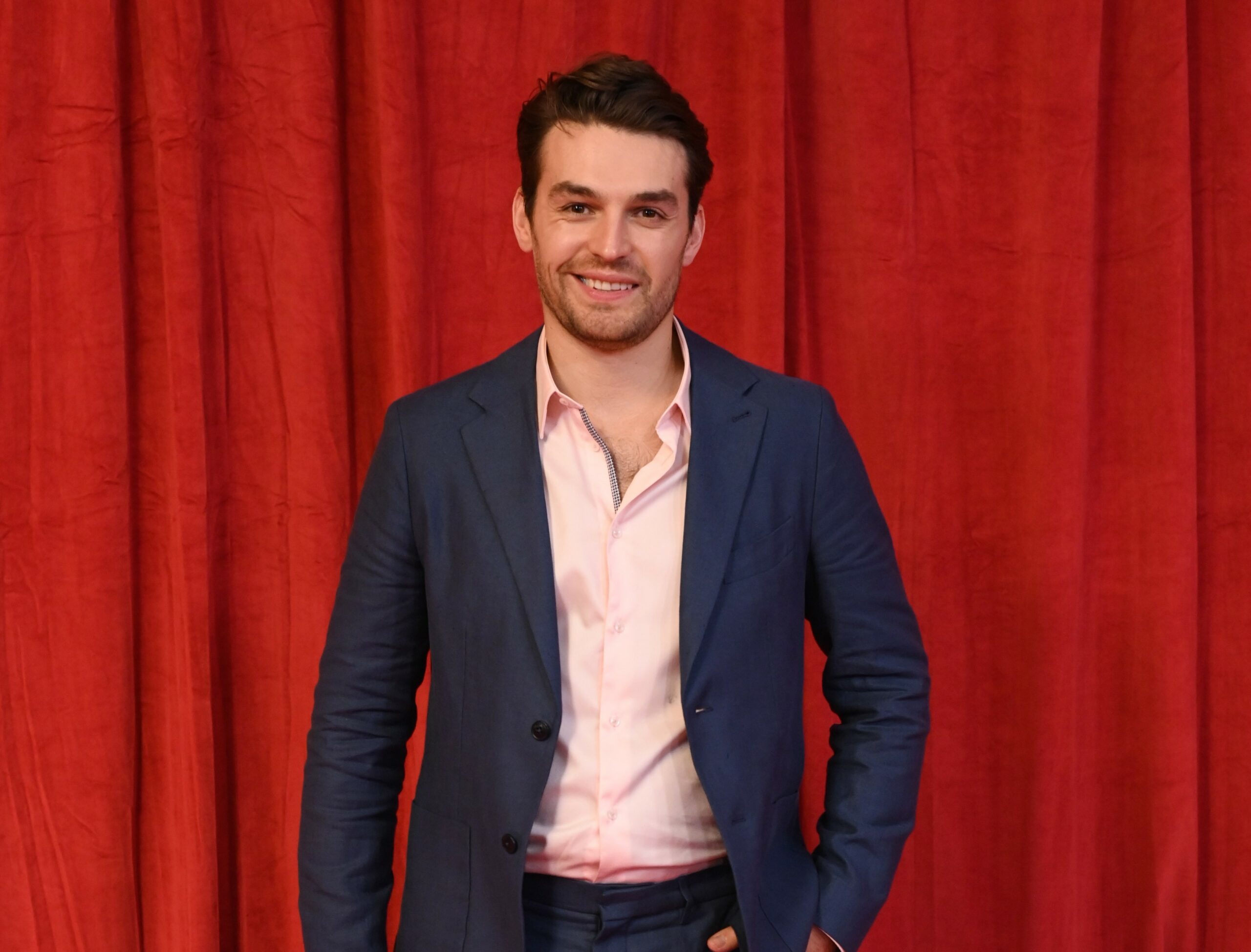 Lawrence Robb smiles on the red carpet at the British Soap Awards