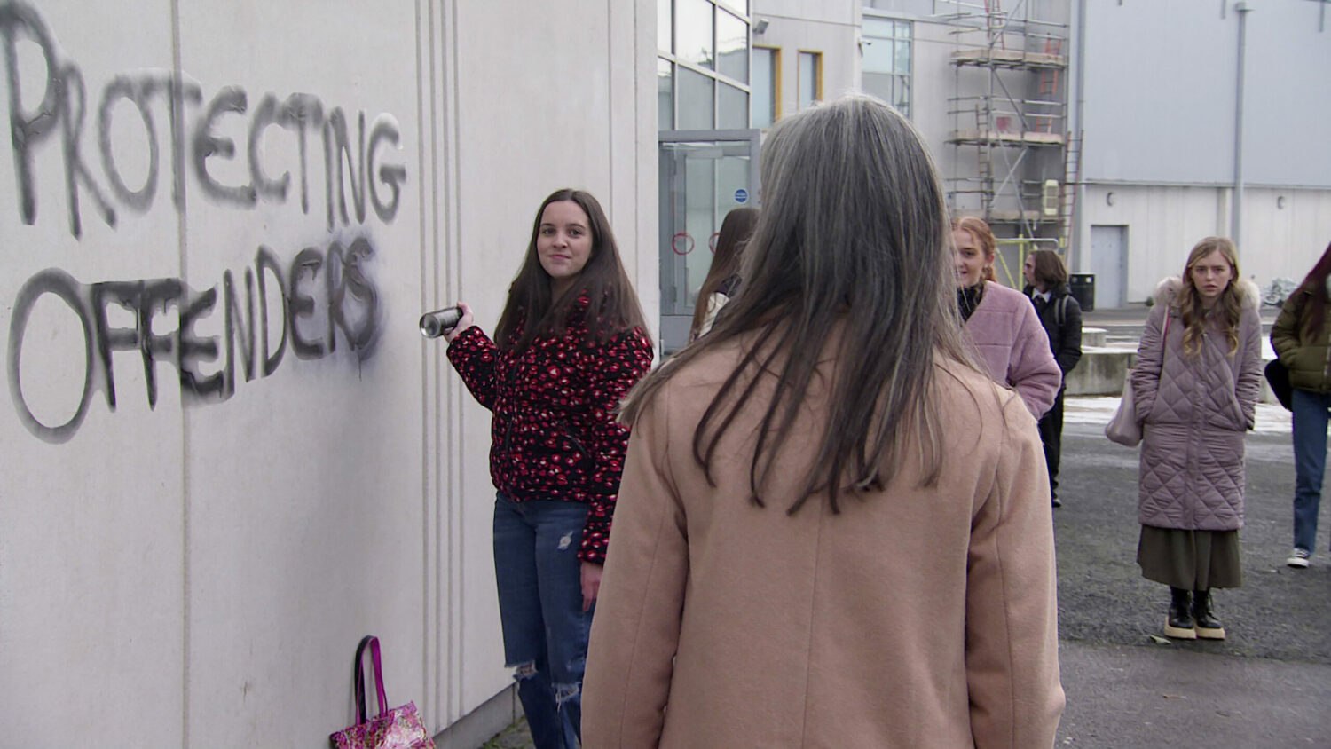 Coronation Street Jan 17 a crowd gathers to watch Amy spray painting the words ‘Stop Protecting Sex Offenders’ onto the side of a building.