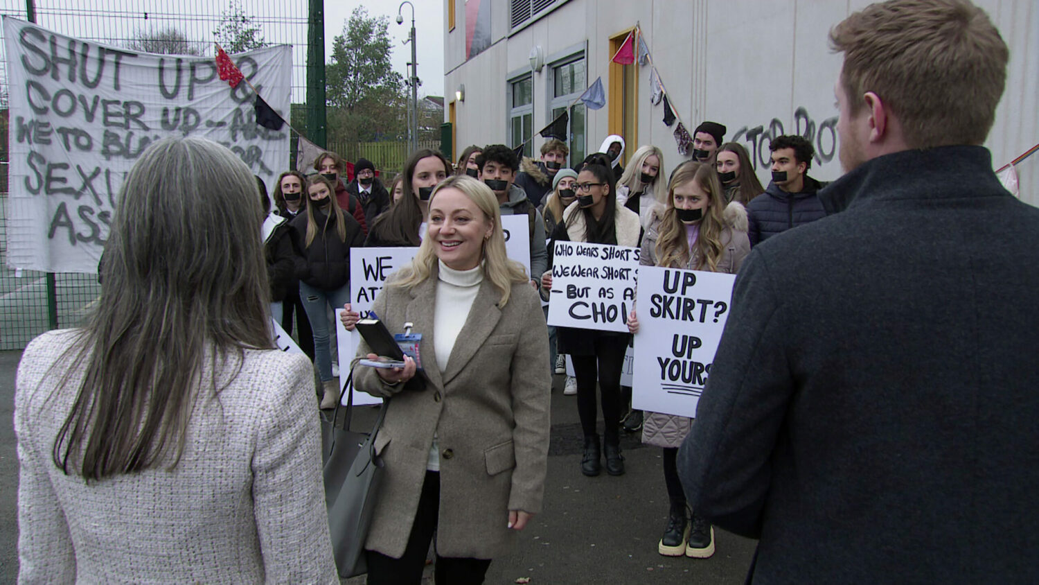 Coronation Street Jan 21 The reporter from the Gazette arrives at the protest, how will Mrs Crawshaw react.