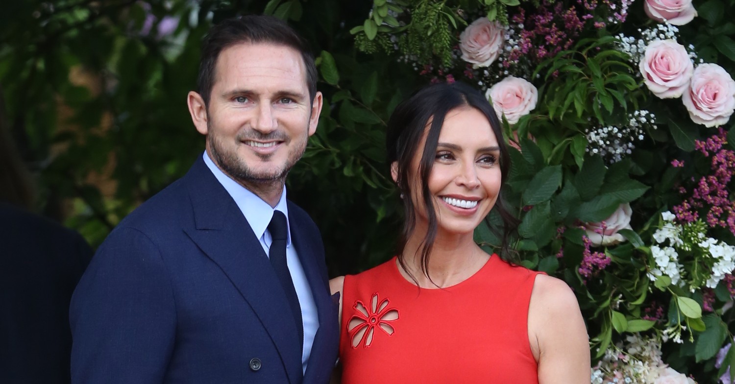 Christine Lampard and husband Frank smiling at a wedding