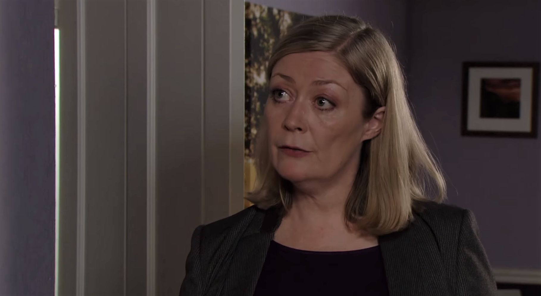 EastEnders DCI Samantha Keeble looks serious as she talks to the Beales