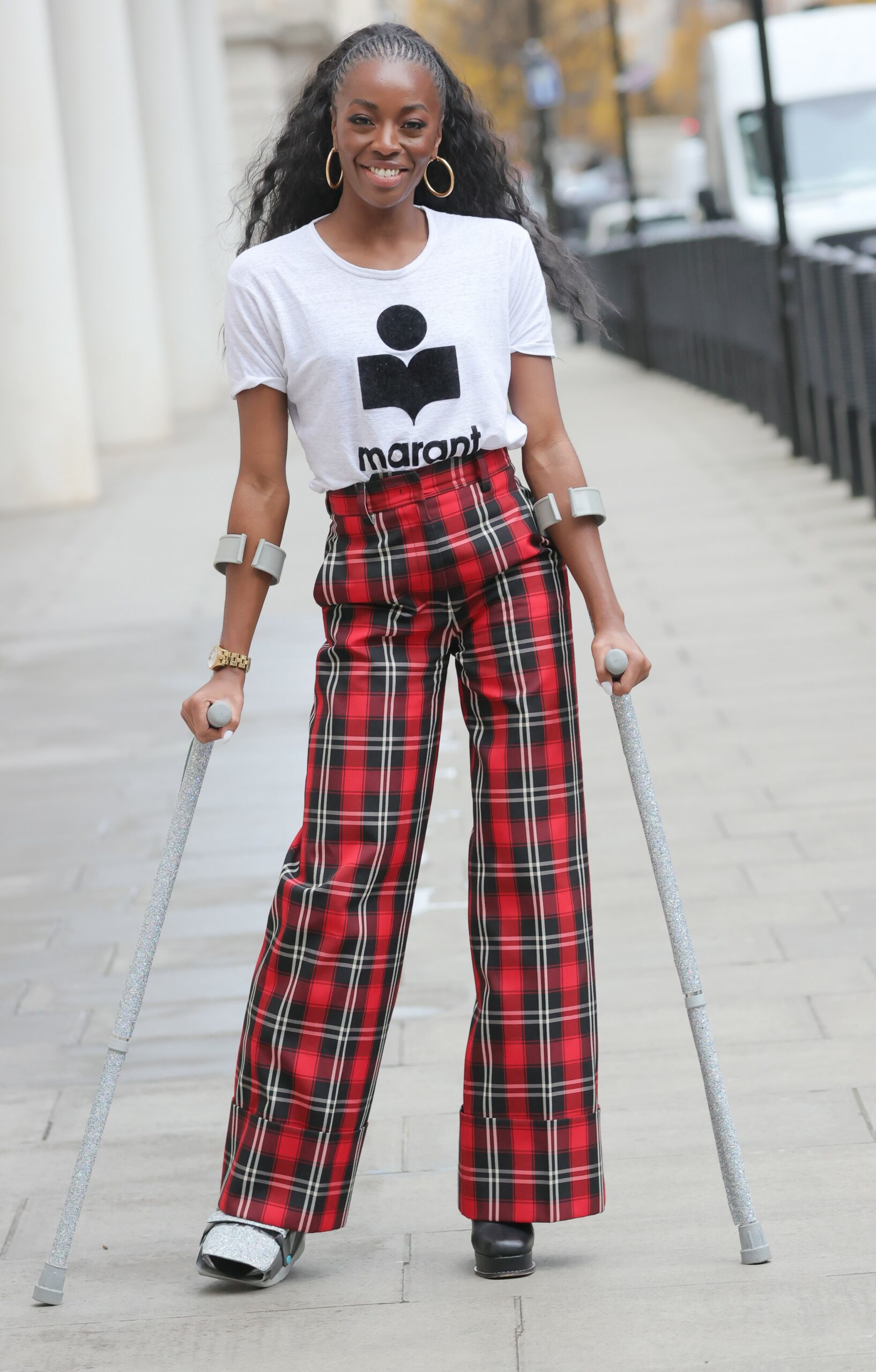 AJ Odudu poses with crutches