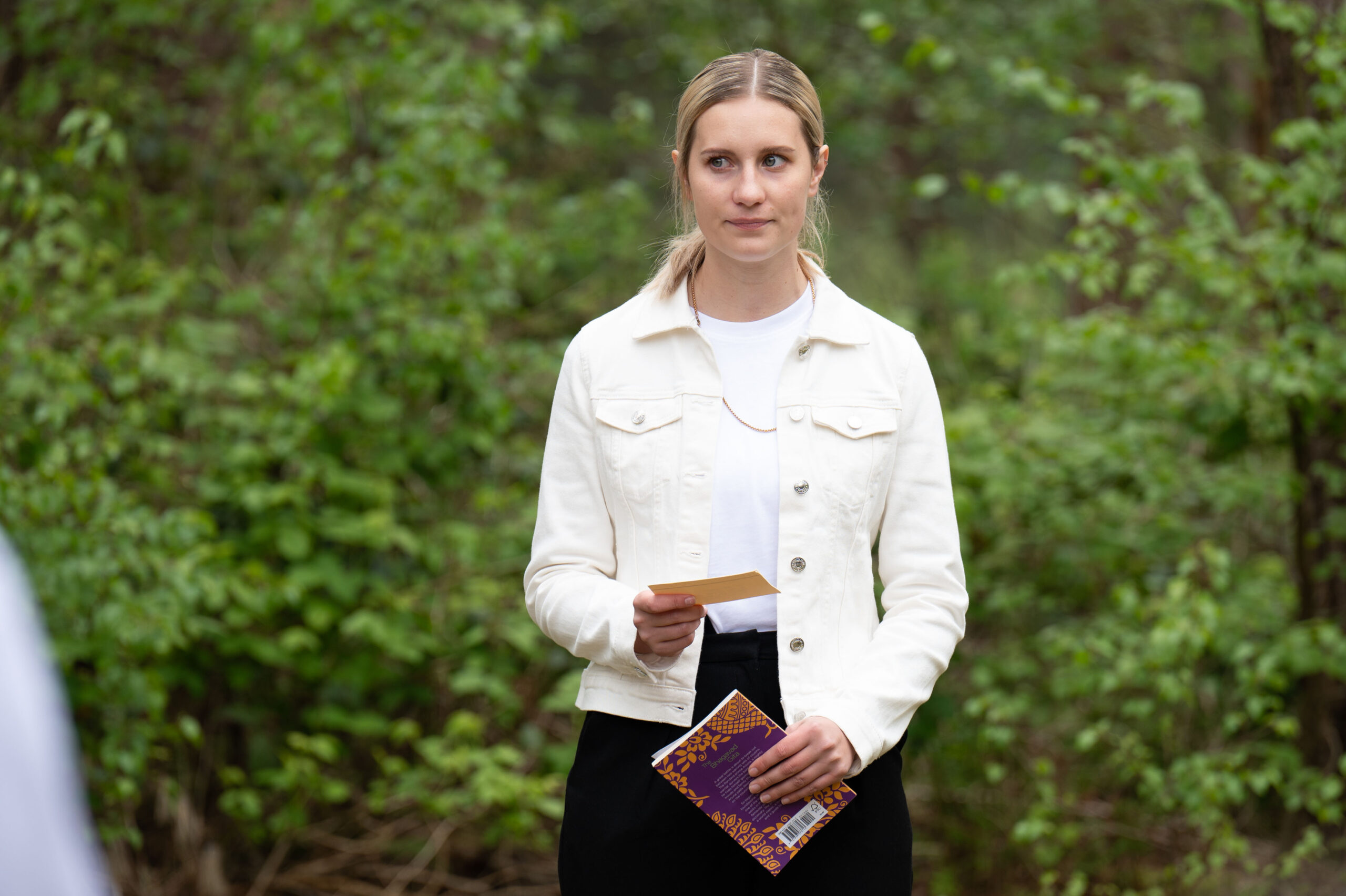 Tess attending Maya's funeral