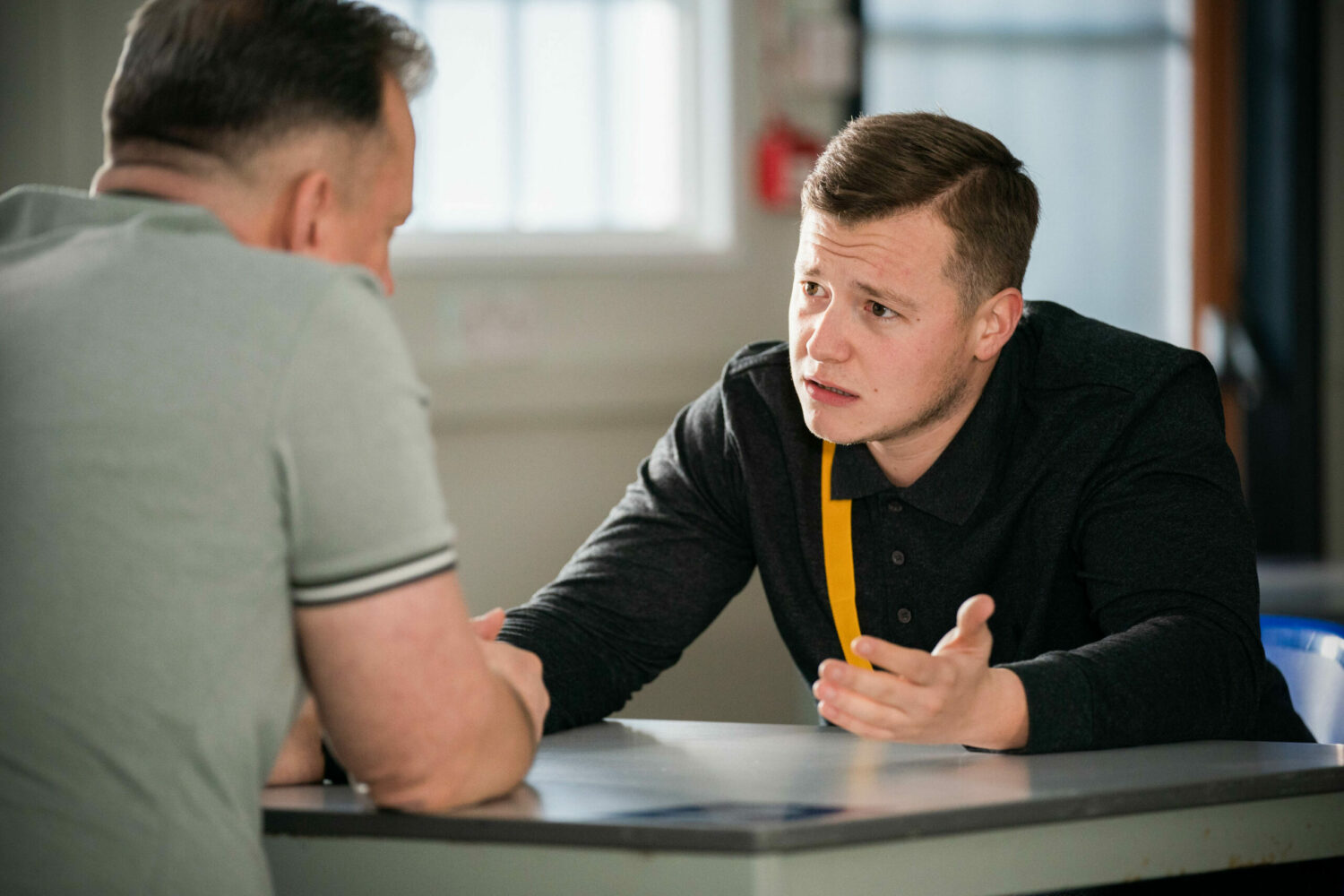 EastEnders Aaron in prison, talking to Harvey