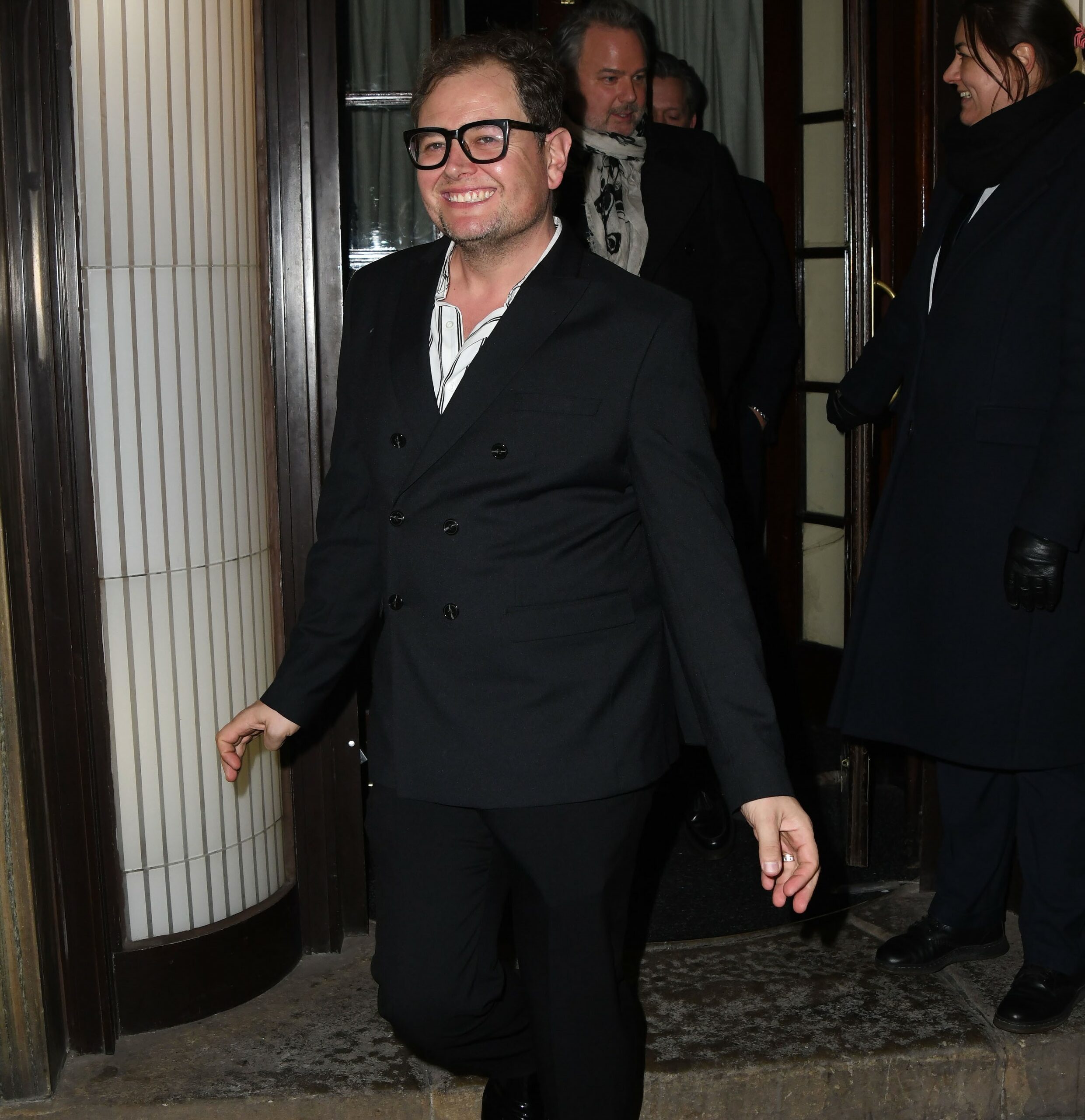 Alan Carr smiles during celebrity event