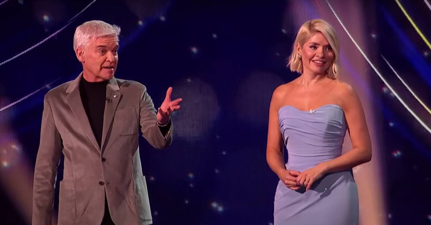 Phillip Schofield gestures as he and Holly Willoughby host Dancing On Ice