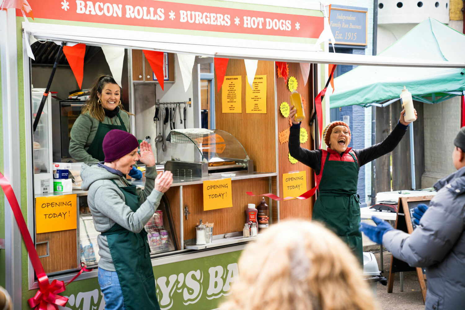 EastEnders Feb 8 Stacey opens her new business venture with the support of Jean and Eve with a long line of customers waiting