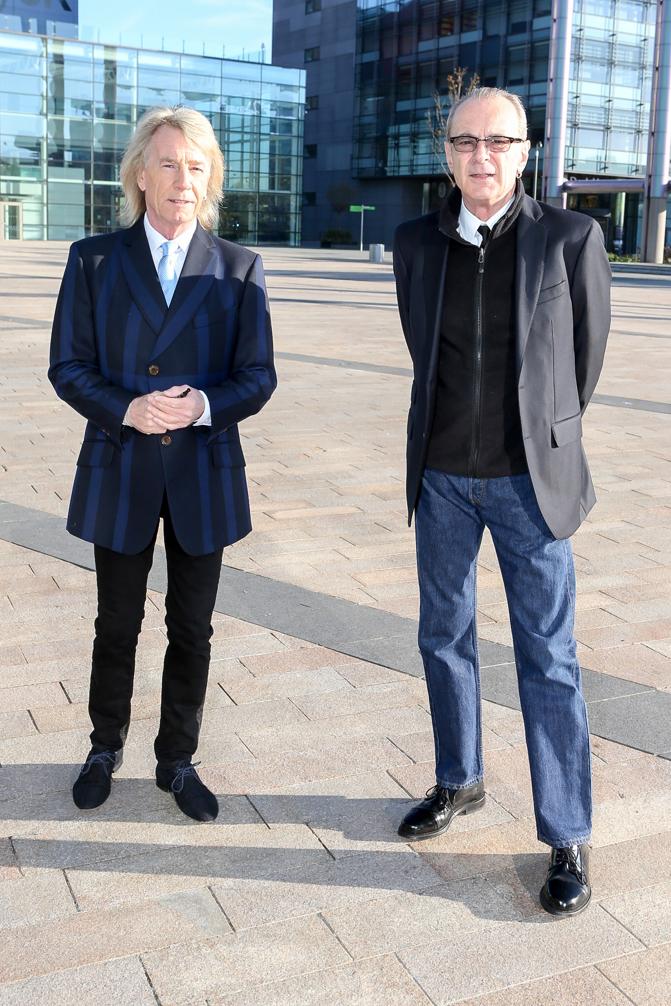 Francis Rossi and Rick Parfitt standing outside together in 2015
