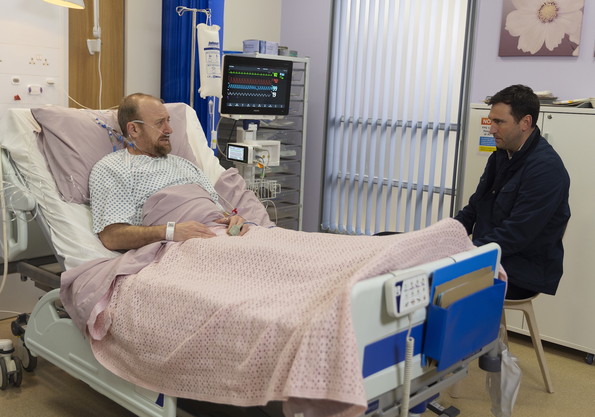 Kit talking to Mal in hospital in Coronation Street