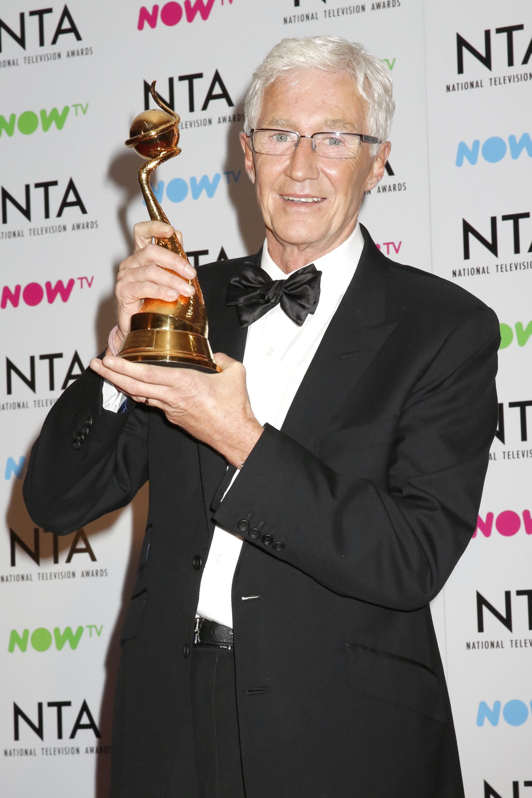 Paul O'Grady poses with h is award at the NTAs