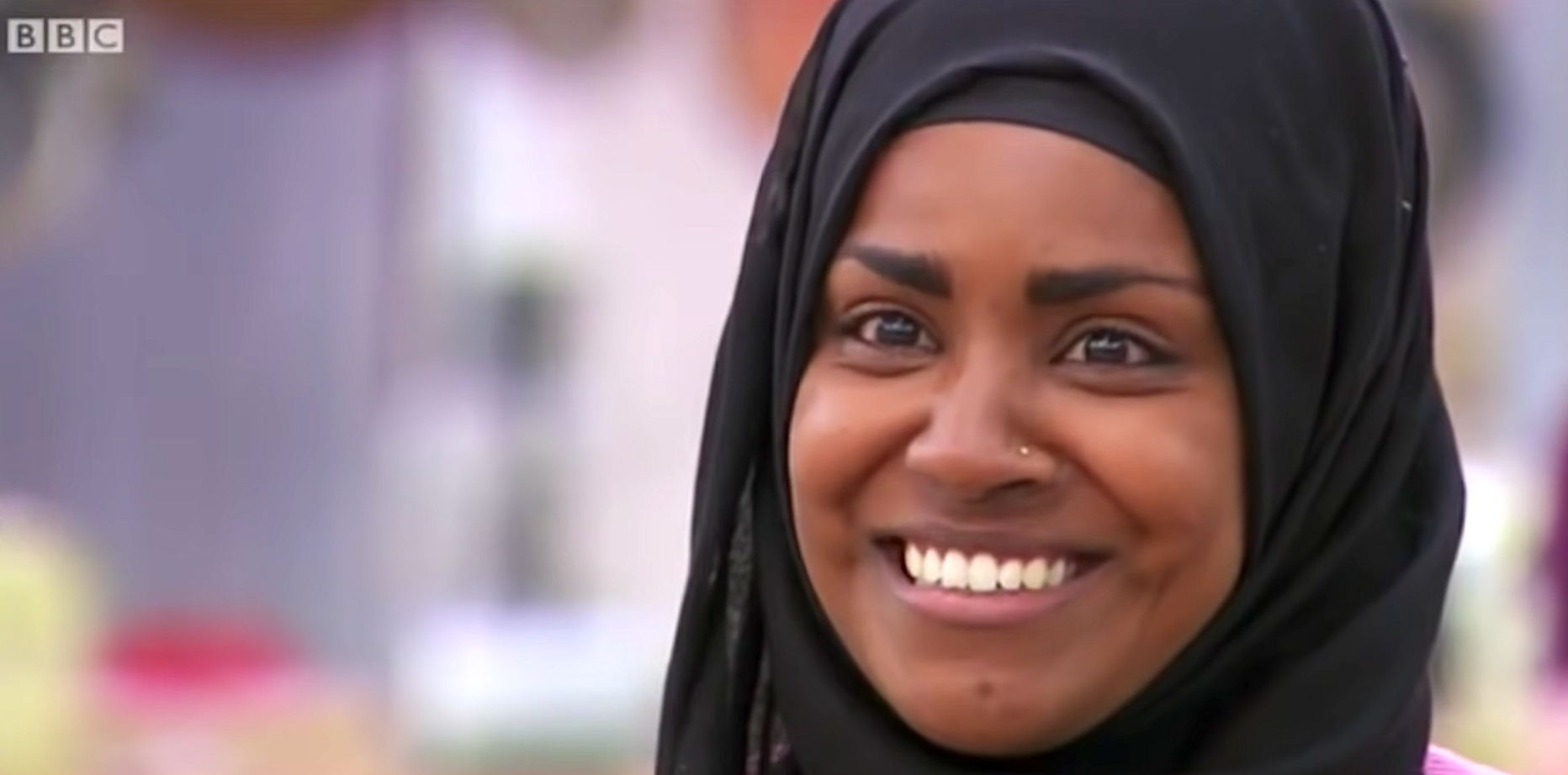 Nadiya Hussain flashing that unforgettable smile on The Great British Bake Off