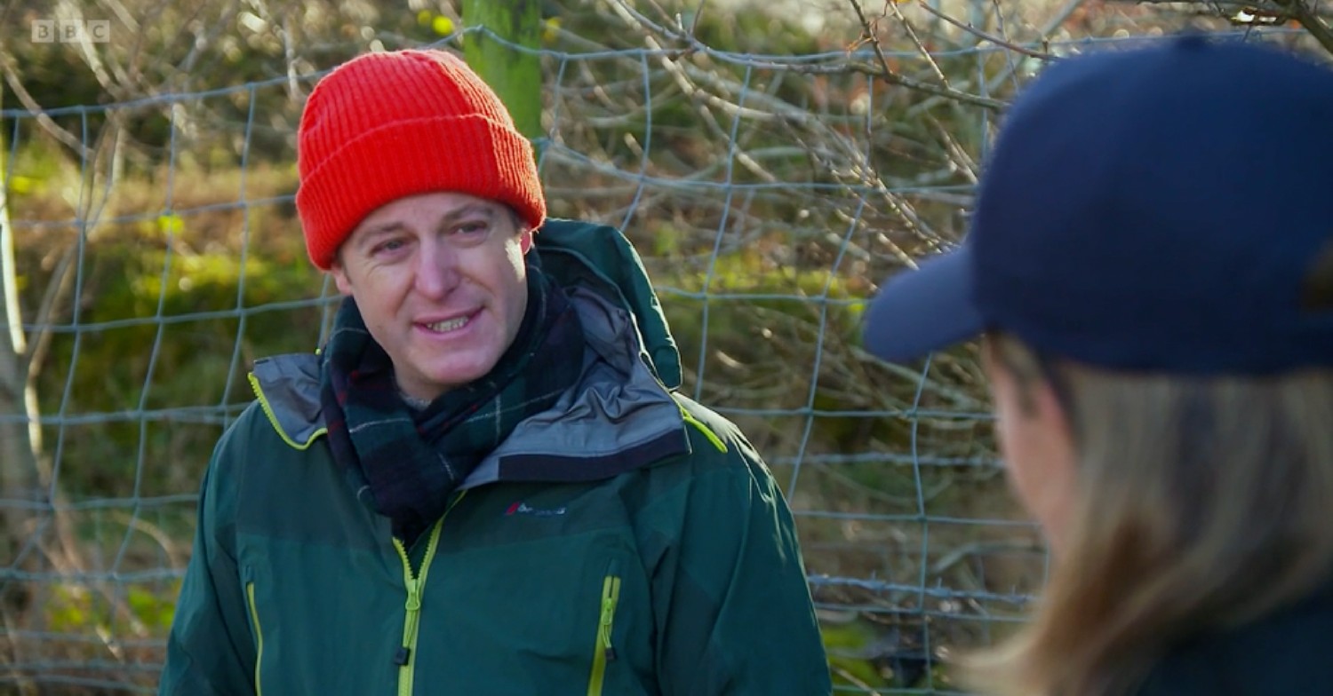 matt baker in an orange beanie and green jacket on bbc countryfile