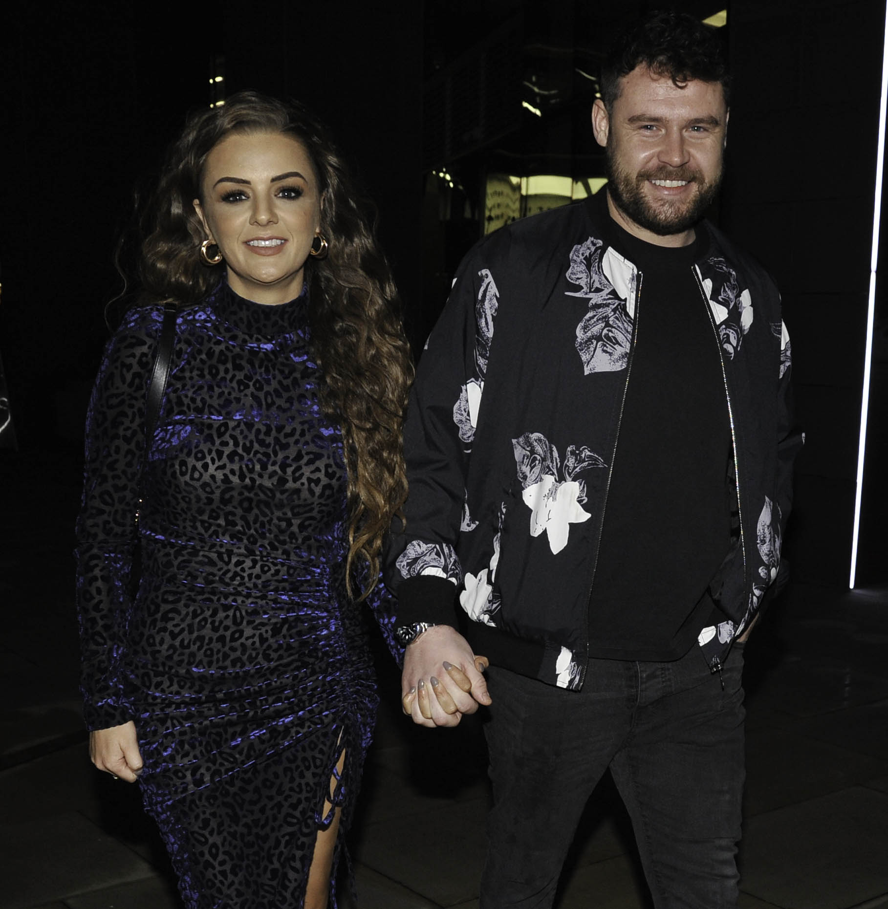 Steph Jones and Danny Miller hold hands as they enjoy a night out together