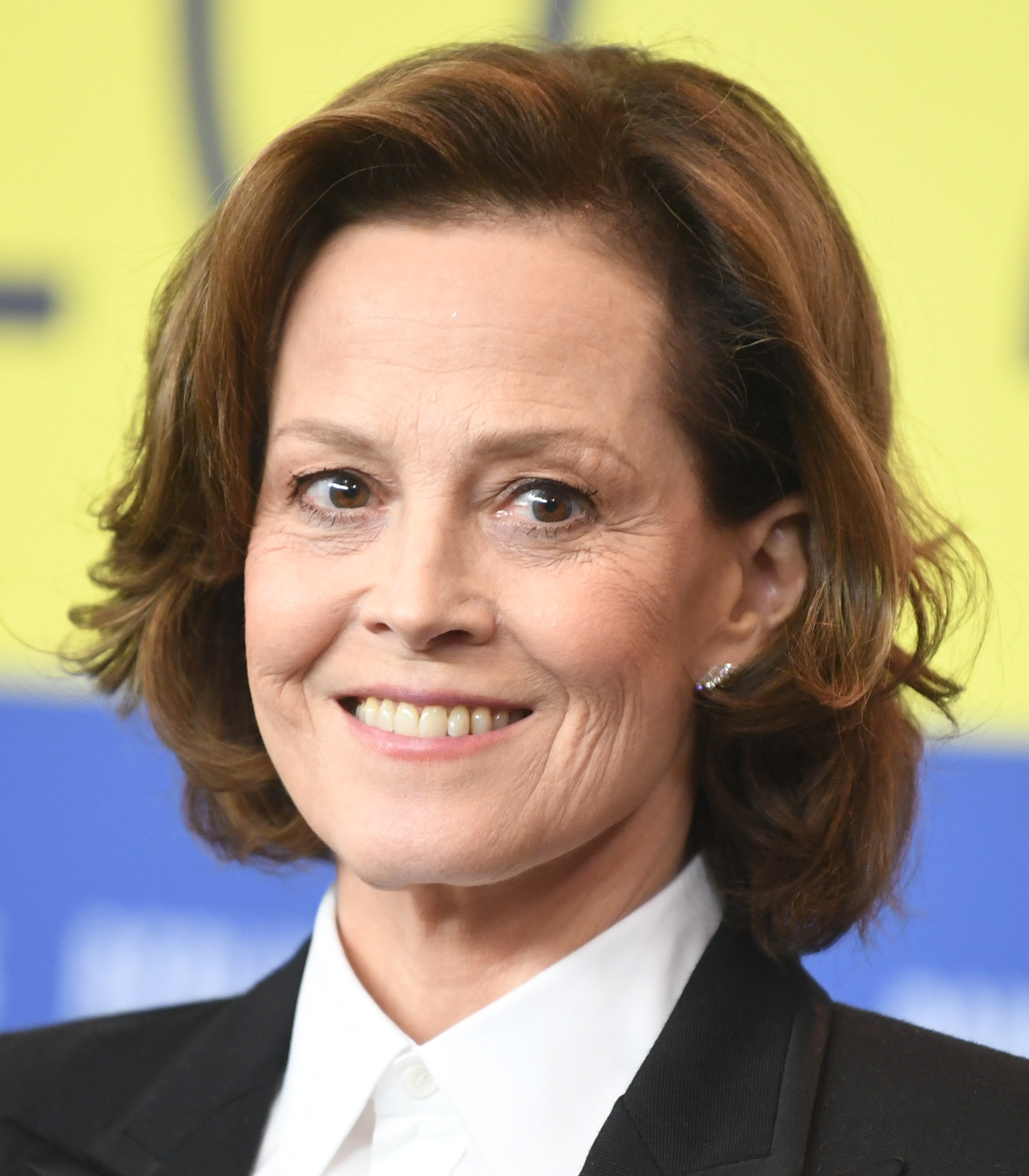 Actress Sigourney Weaver smiles on the red carpet at a Hollywood event